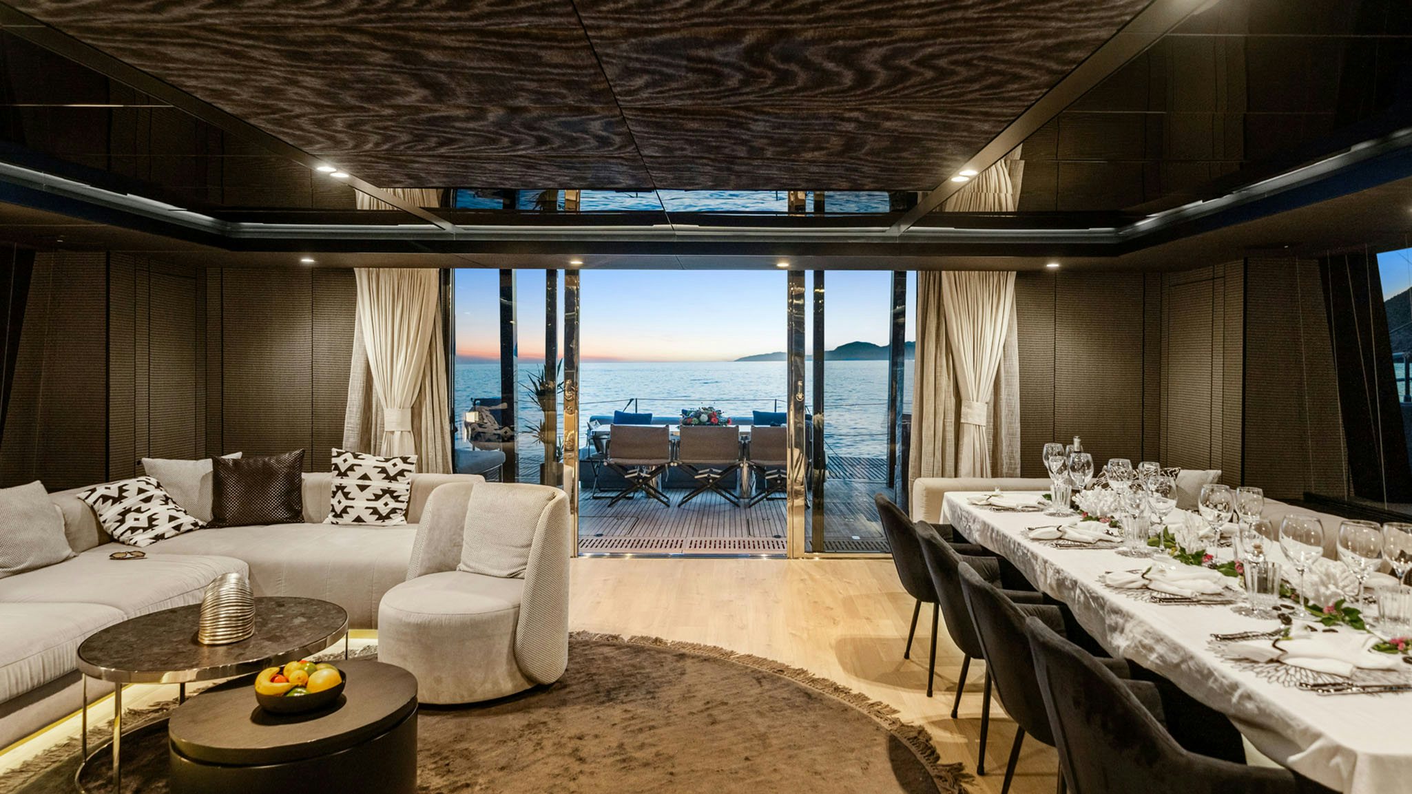 a living room with a large balcony aboard GRAYA Yacht for Charter