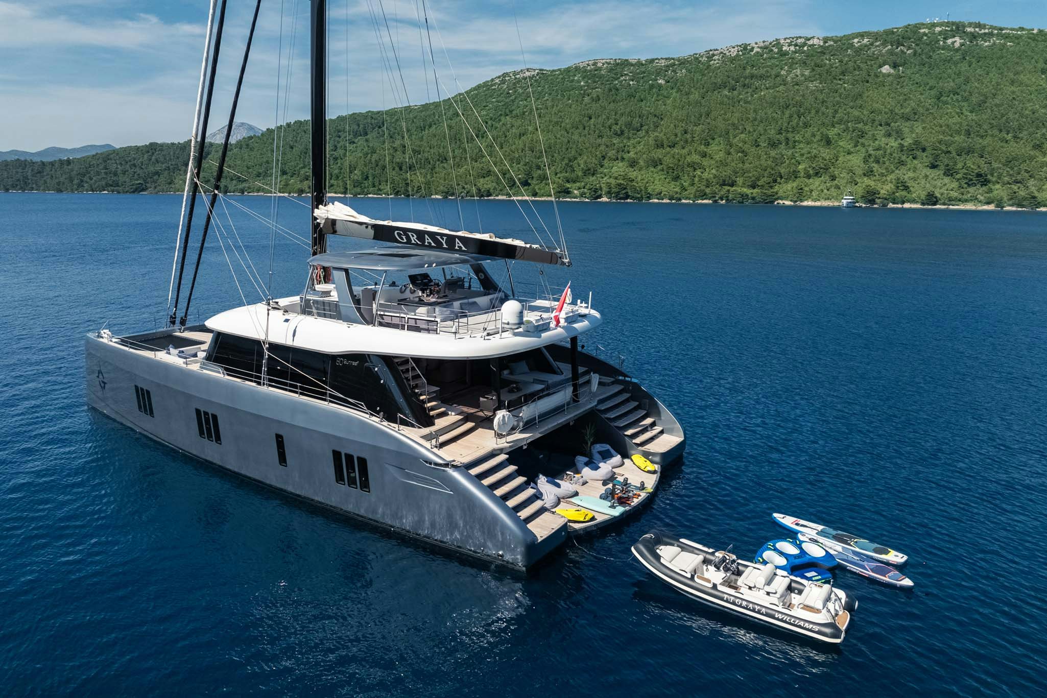 a boat and a helicopter in the water aboard GRAYA Yacht for Charter