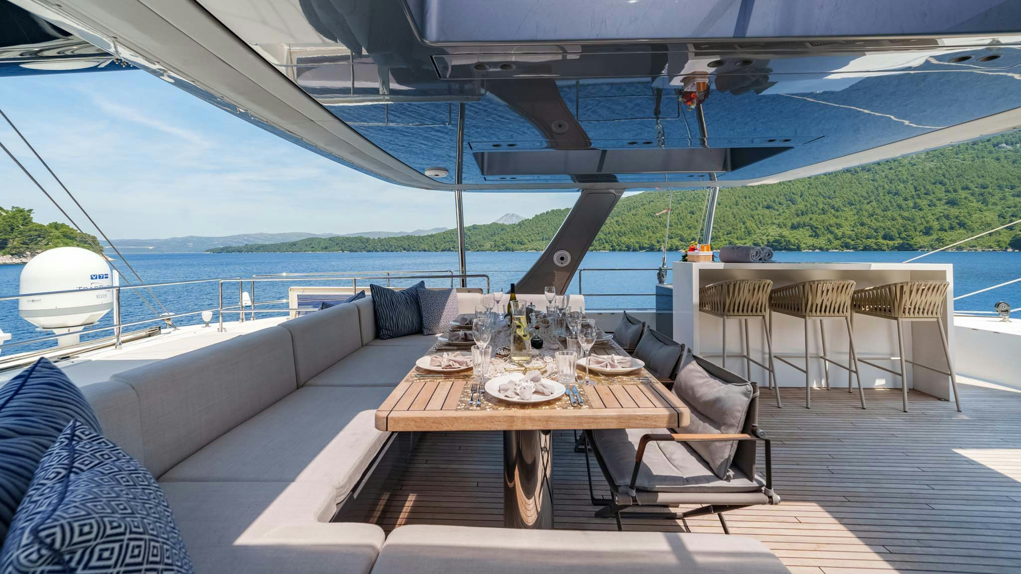 a table on a deck aboard GRAYA Yacht for Charter