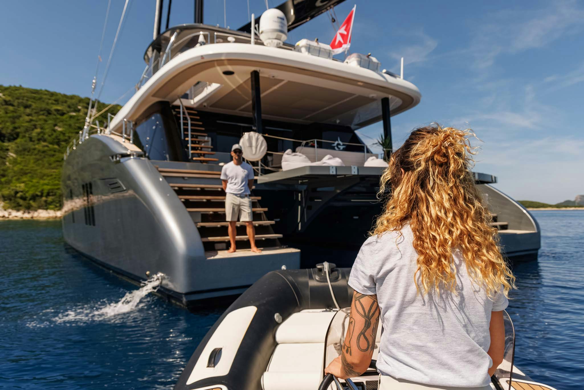 a couple of people on a boat aboard GRAYA Yacht for Charter