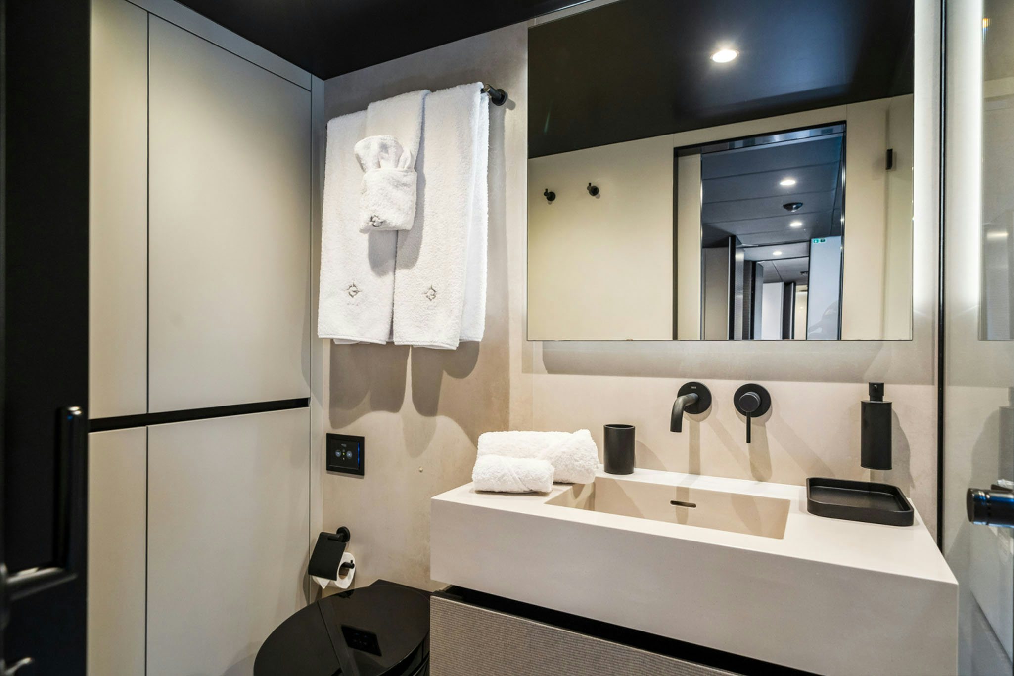 a bathroom with a large mirror aboard GRAYA Yacht for Charter