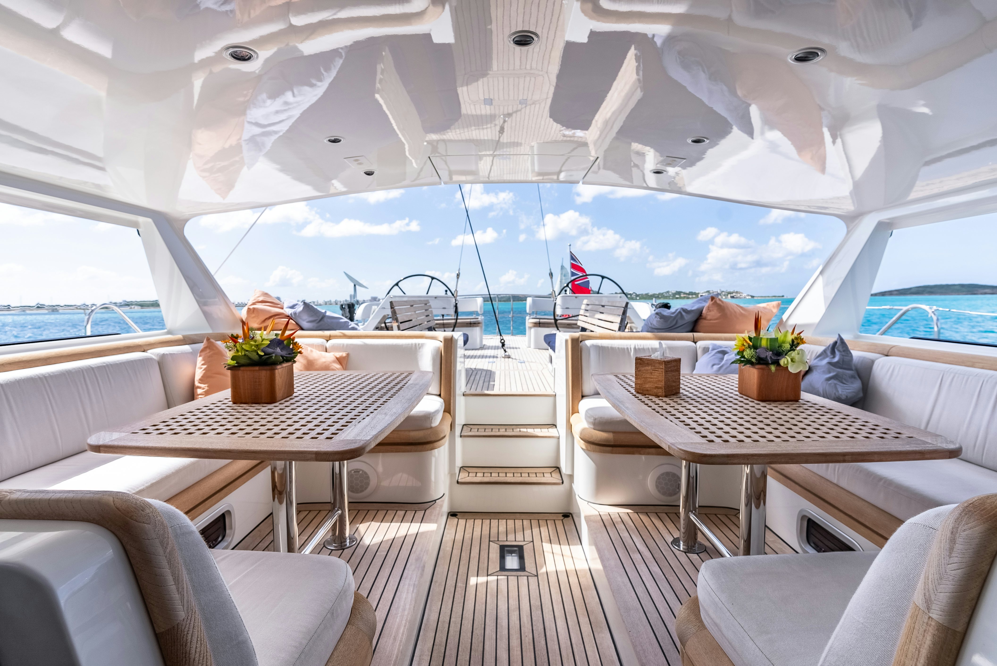 a room with a table and chairs aboard LA JOIE DE MER Yacht for Sale