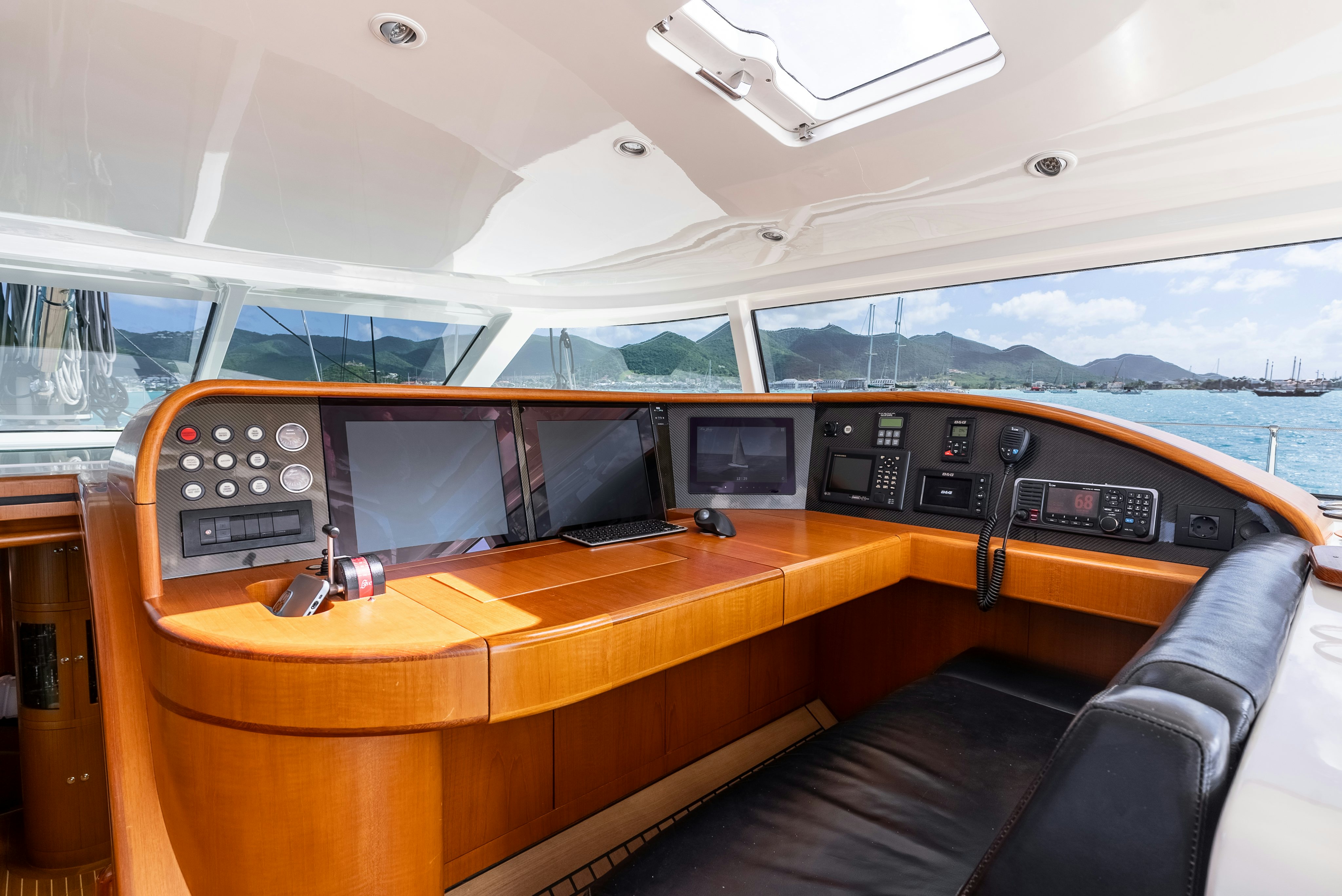 a boat with a desk and a computer on it aboard LA JOIE DE MER Yacht for Sale