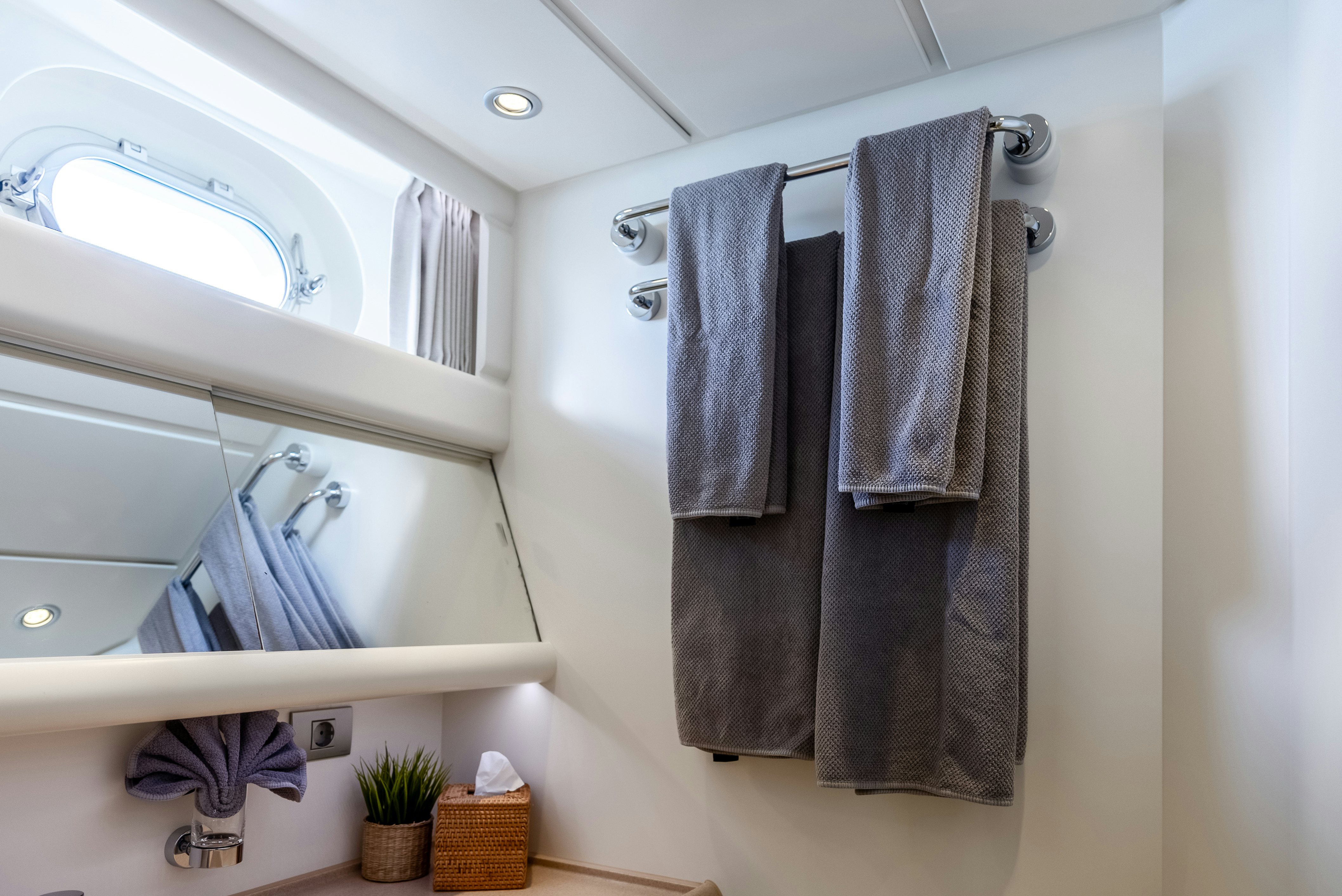 a bathroom with towels on the rack aboard LA JOIE DE MER Yacht for Sale