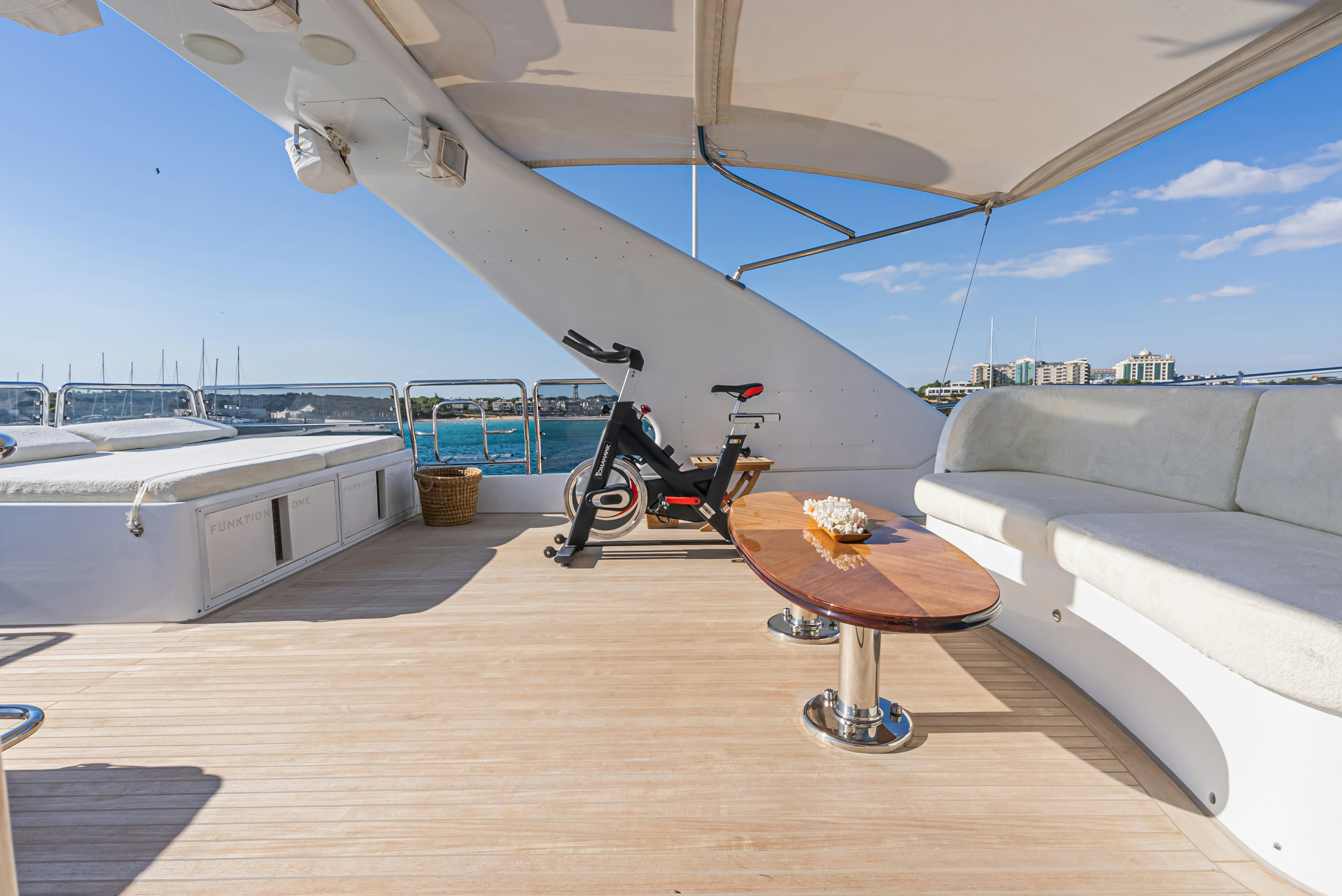 a bike parked on a wooden deck aboard STELLA FIERA Yacht for Sale