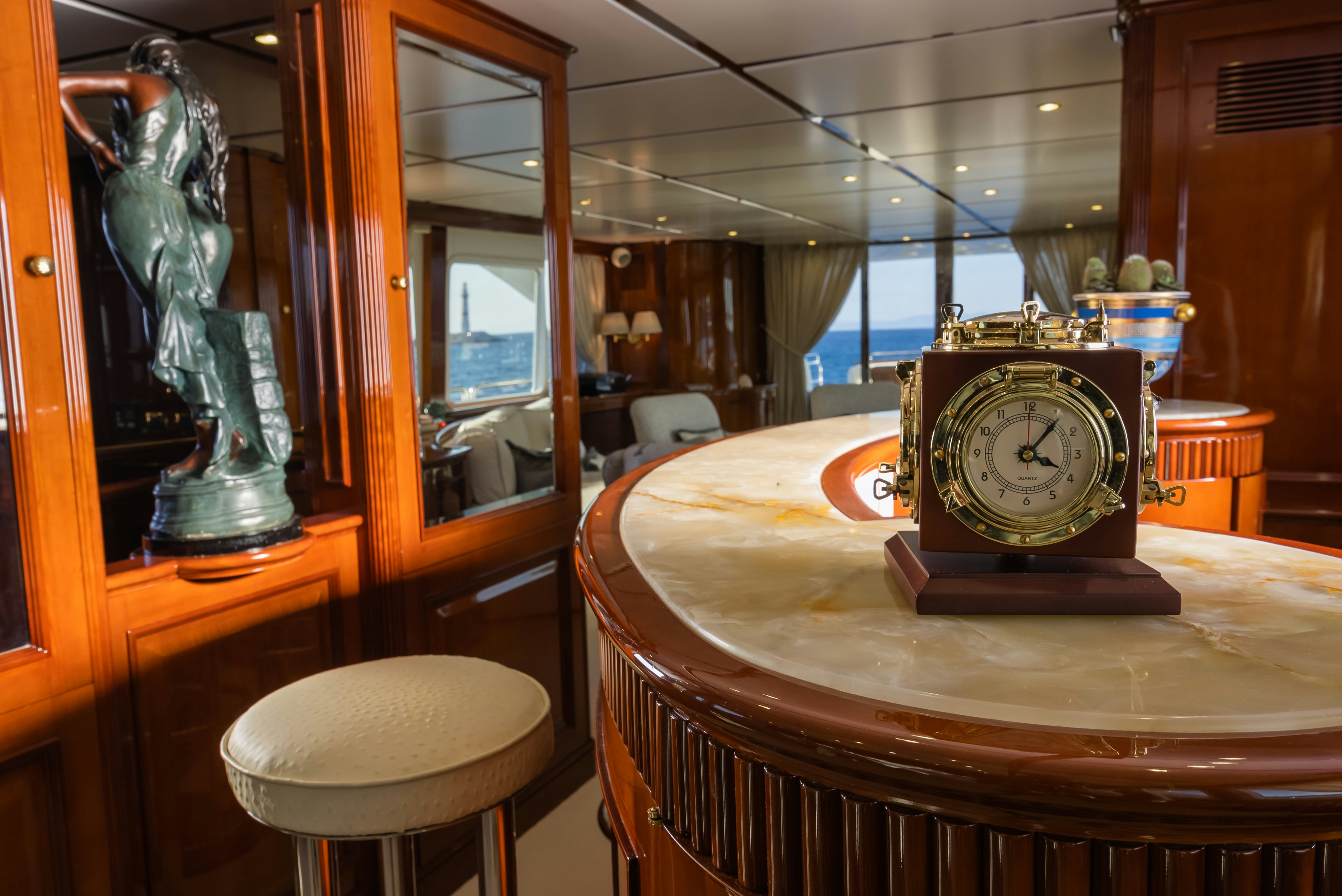 a clock on a table aboard STELLA FIERA Yacht for Sale