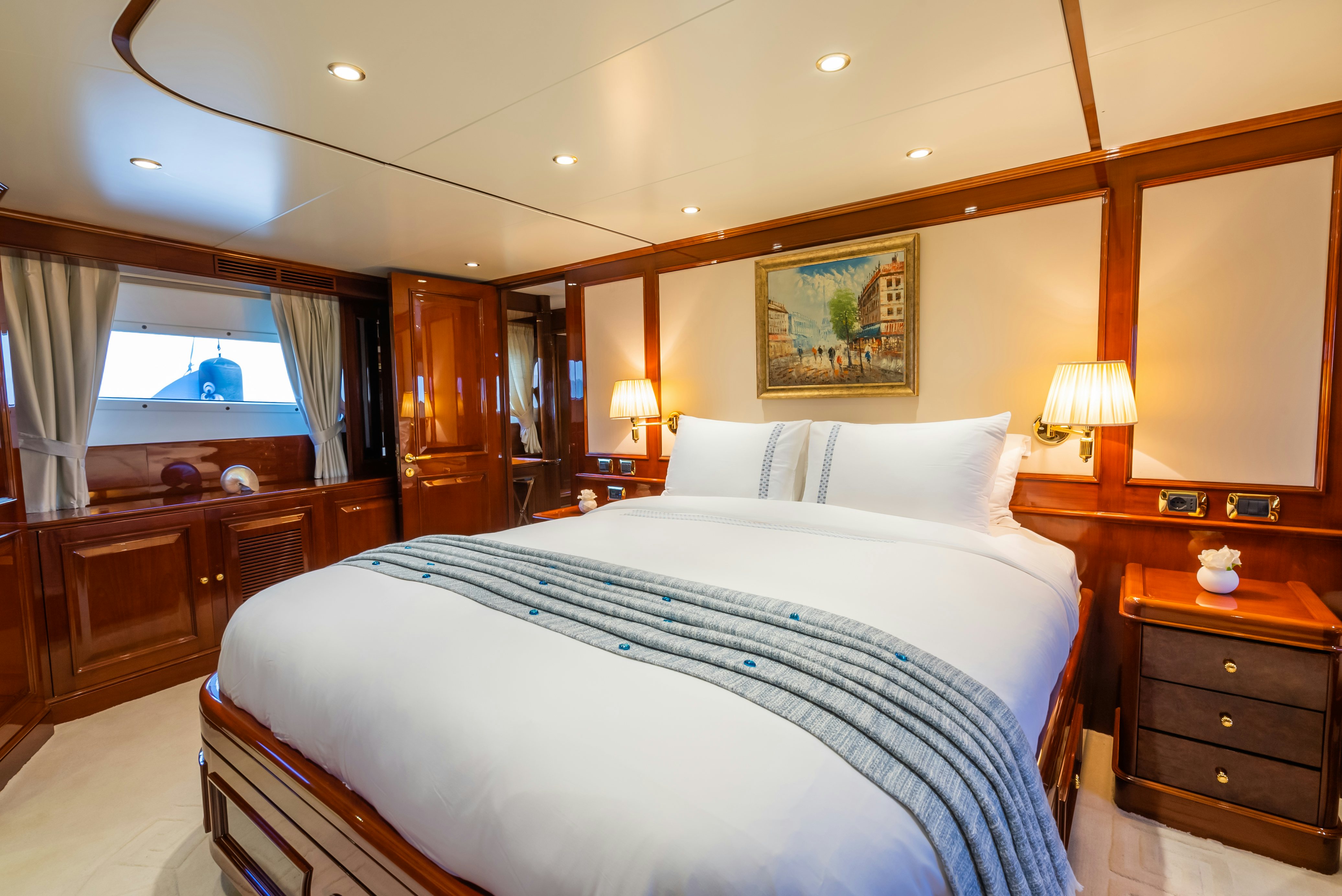 a bed with white sheets aboard STELLA FIERA Yacht for Sale