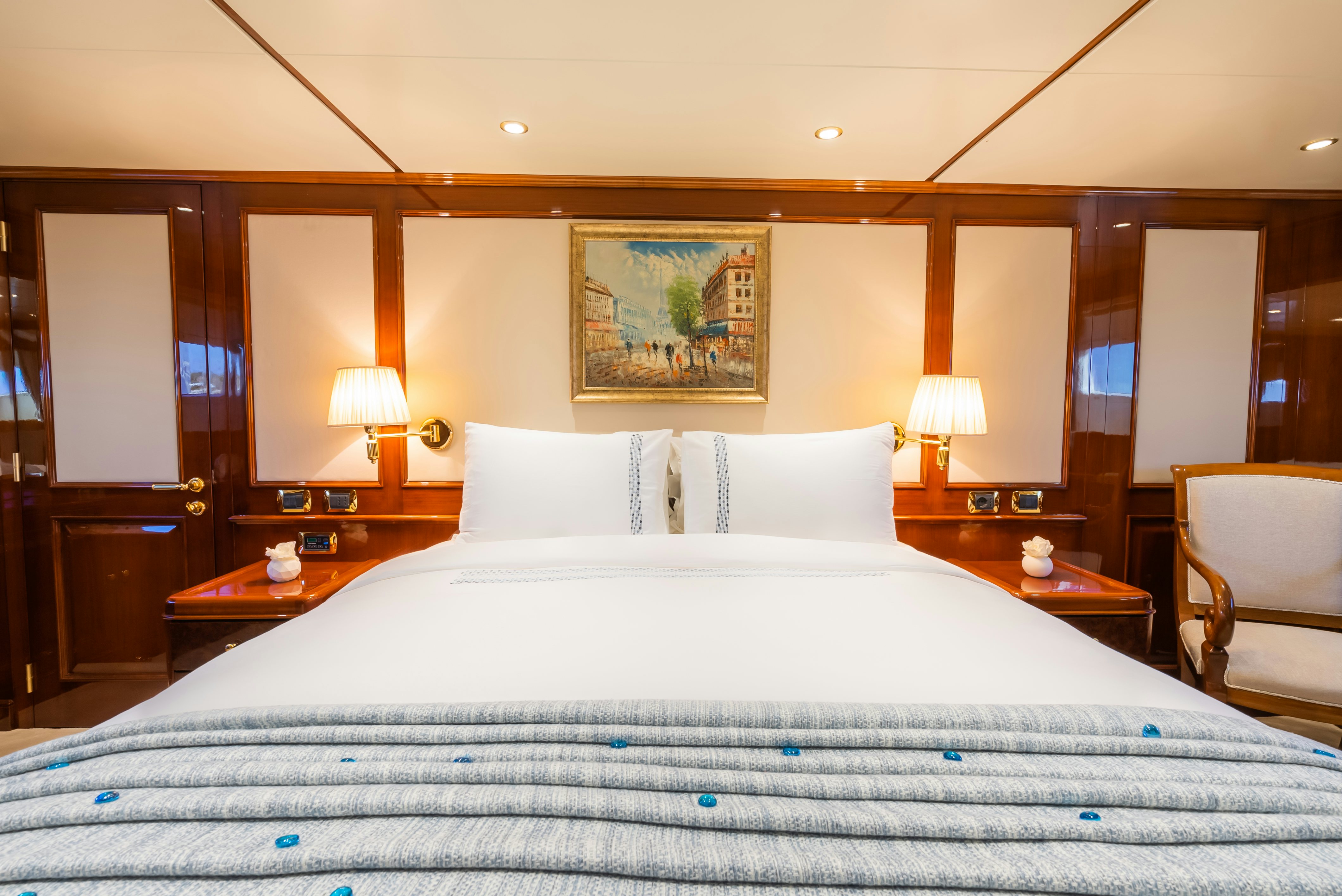 a large bed with white sheets aboard STELLA FIERA Yacht for Sale