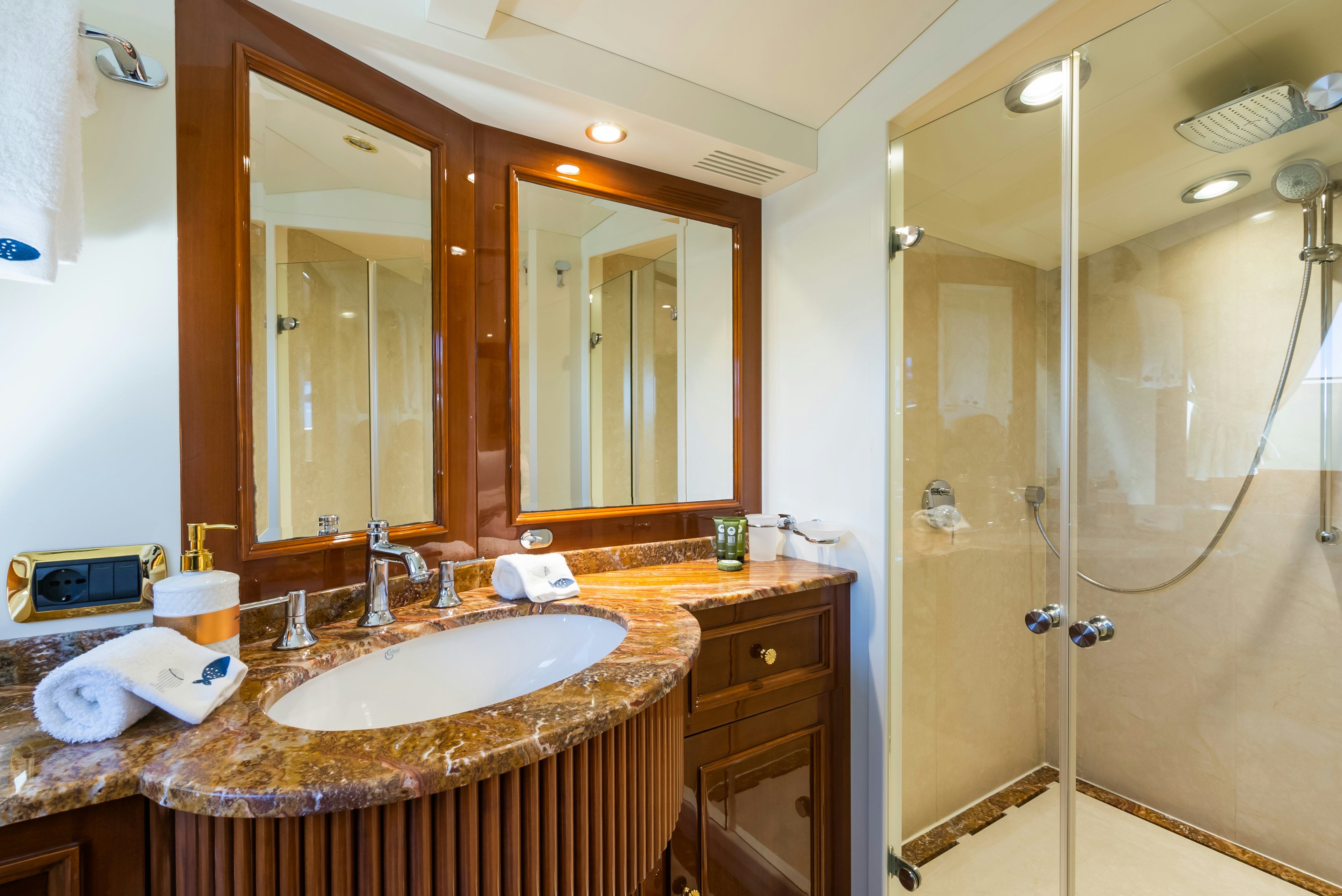 a bathroom with a sink and a shower aboard STELLA FIERA Yacht for Sale