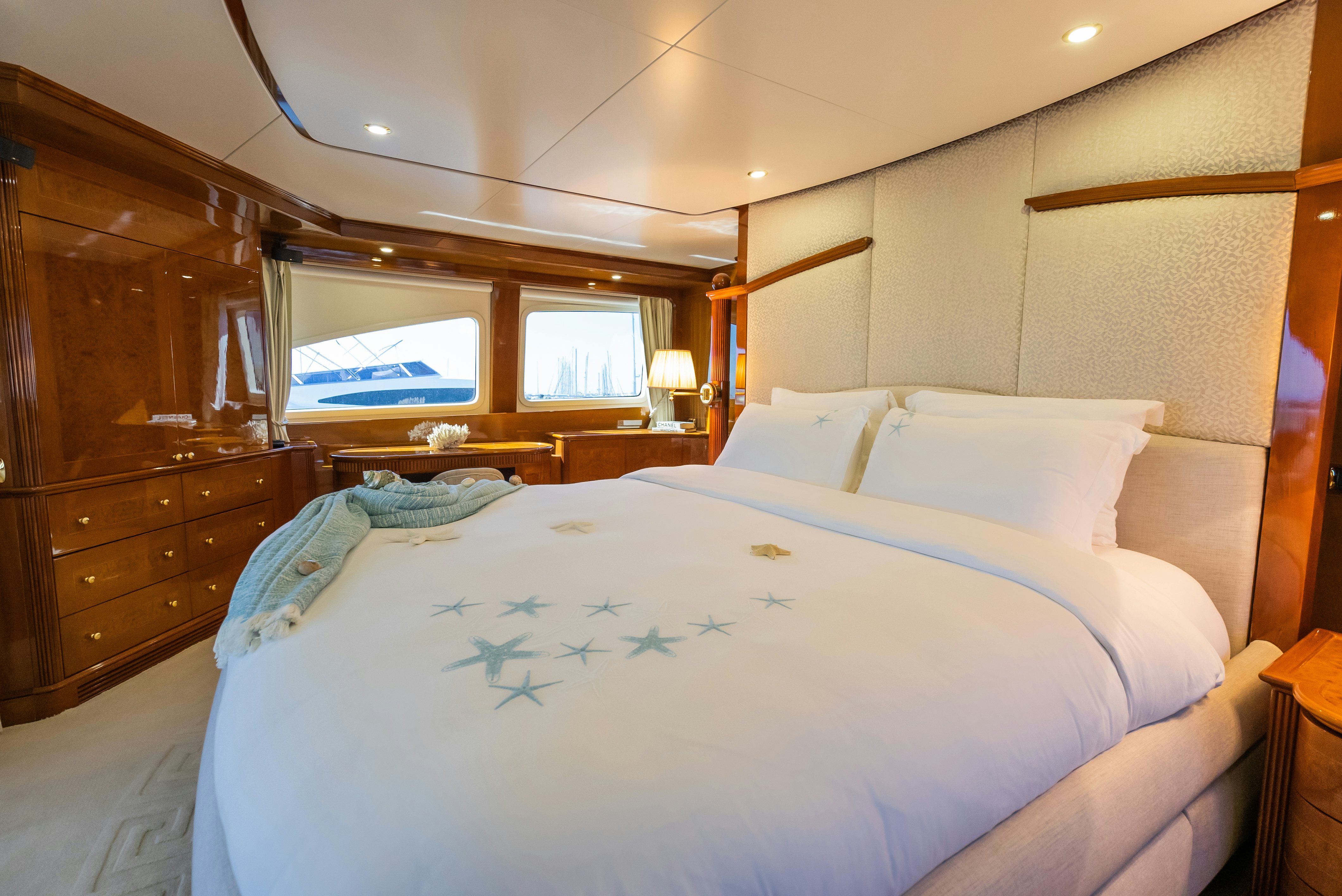 a bed with white sheets aboard STELLA FIERA Yacht for Sale