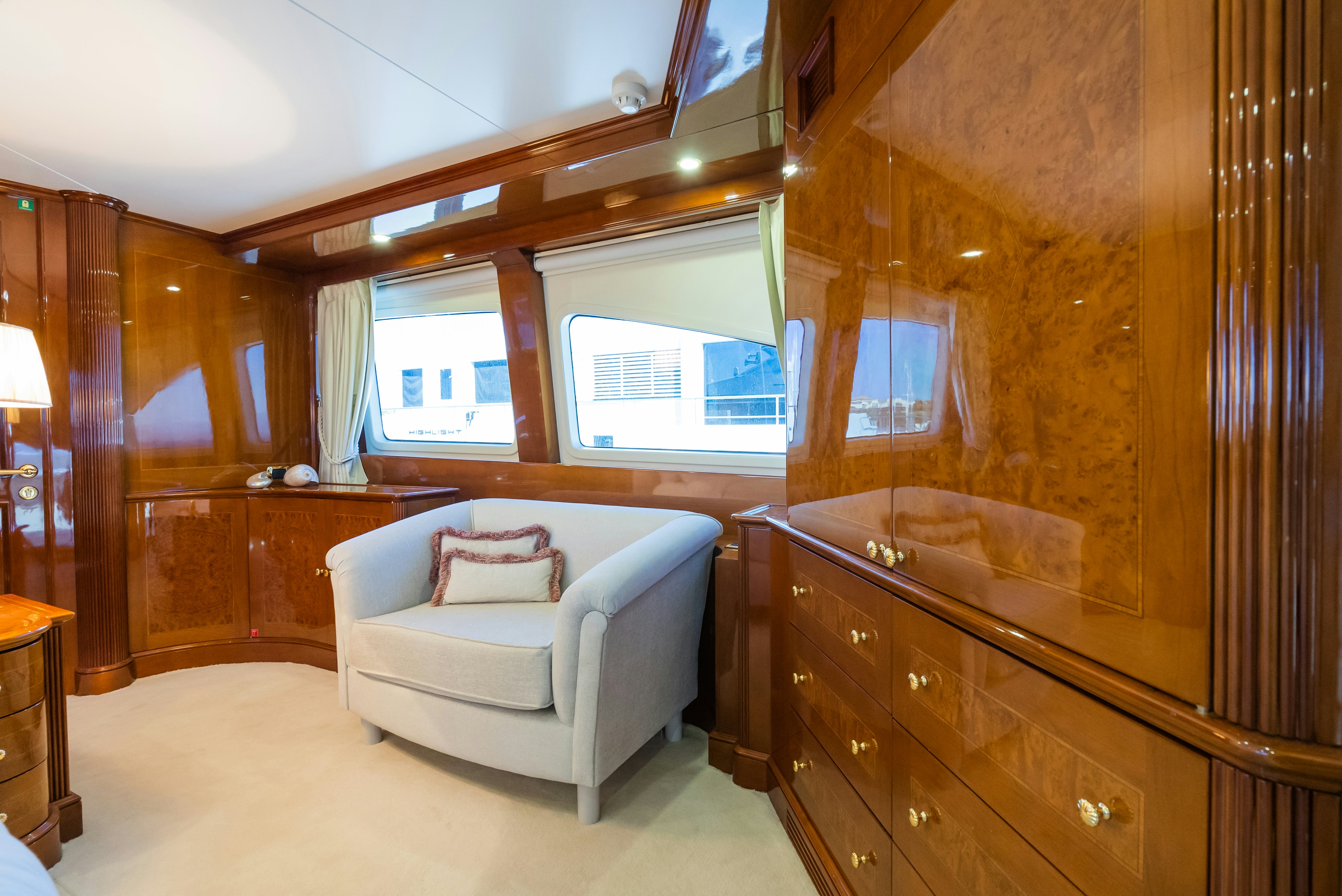 a room with a couch and a mirror aboard STELLA FIERA Yacht for Sale
