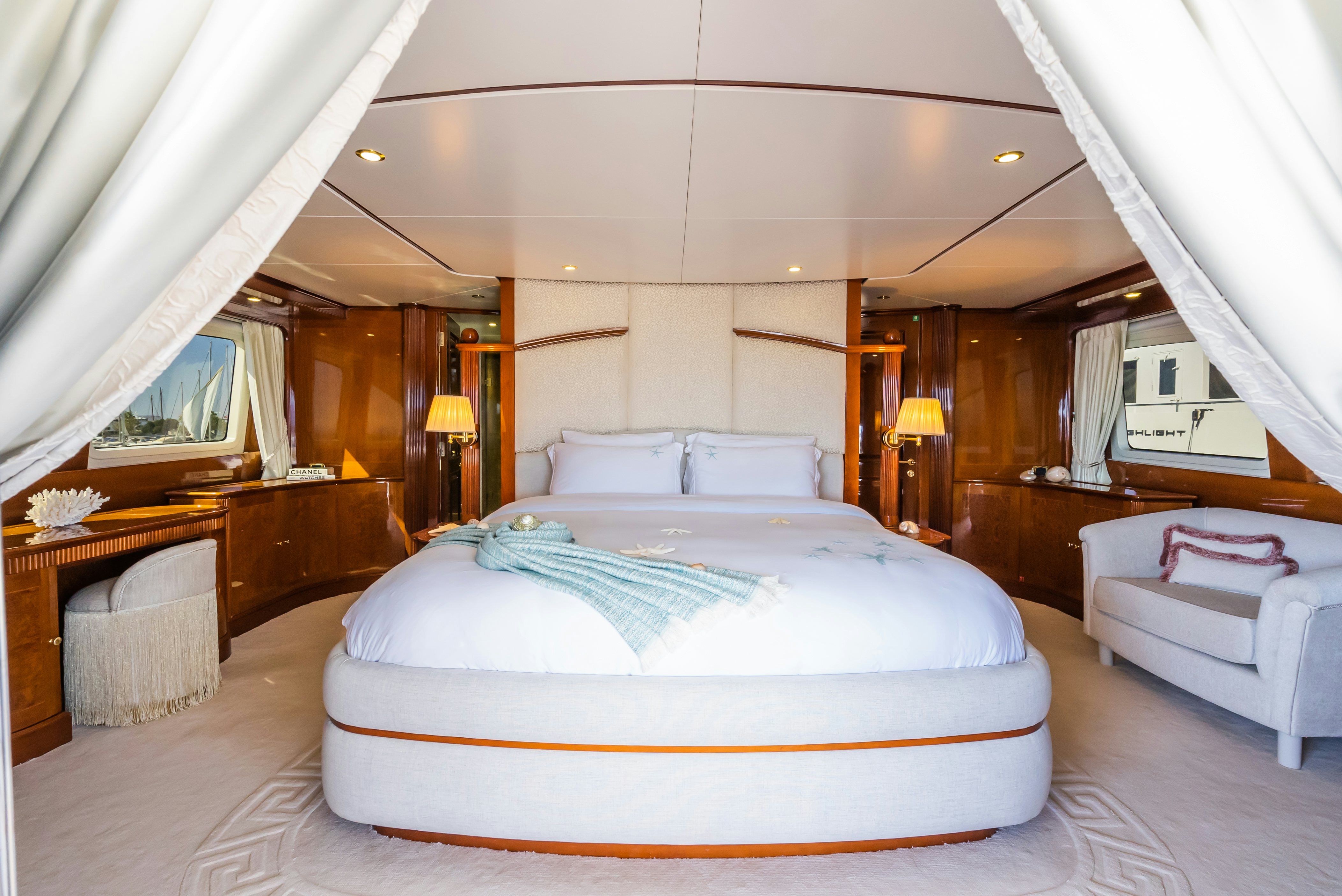 a bedroom with a bed and a desk aboard STELLA FIERA Yacht for Sale