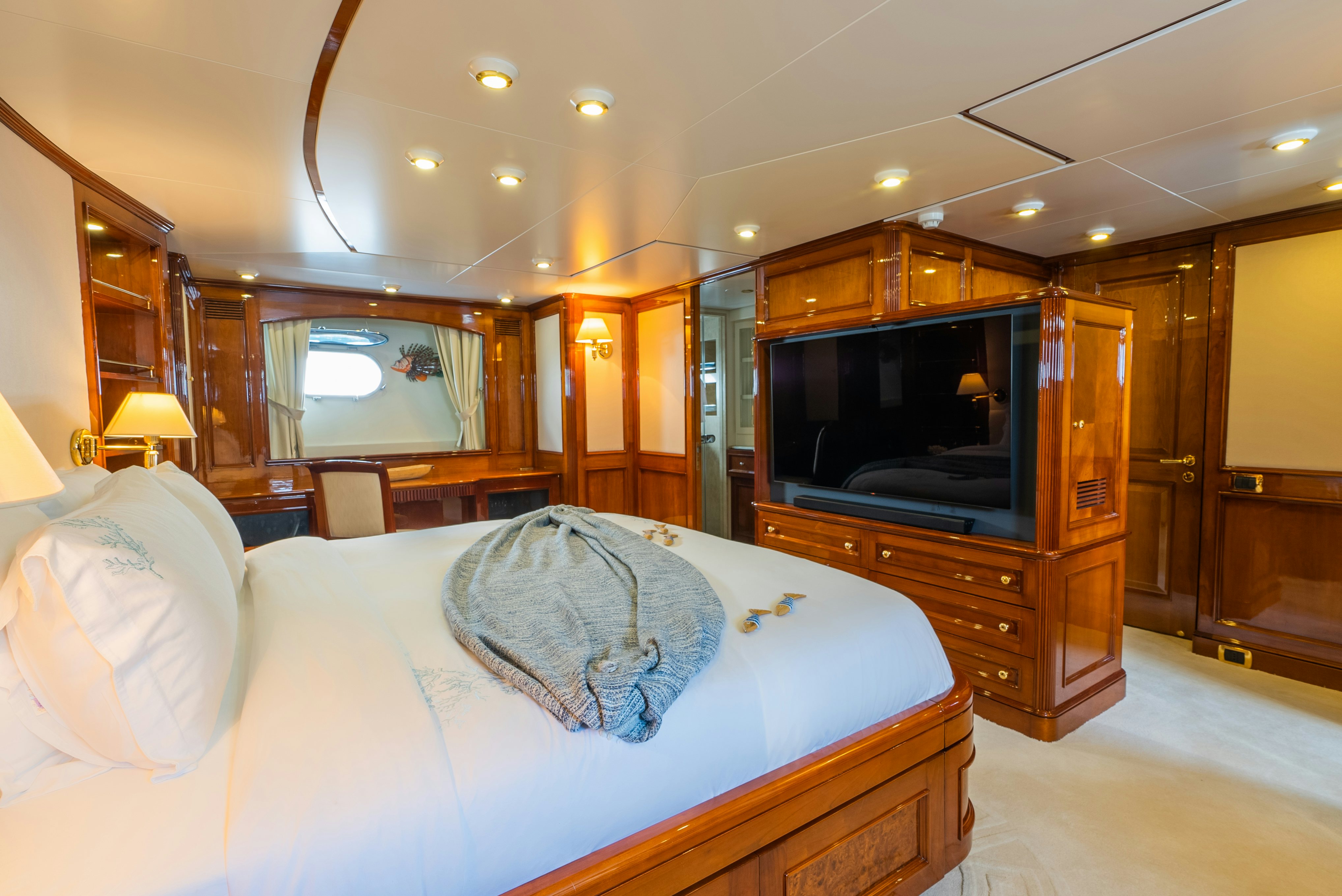 a bedroom with a large bed aboard STELLA FIERA Yacht for Sale