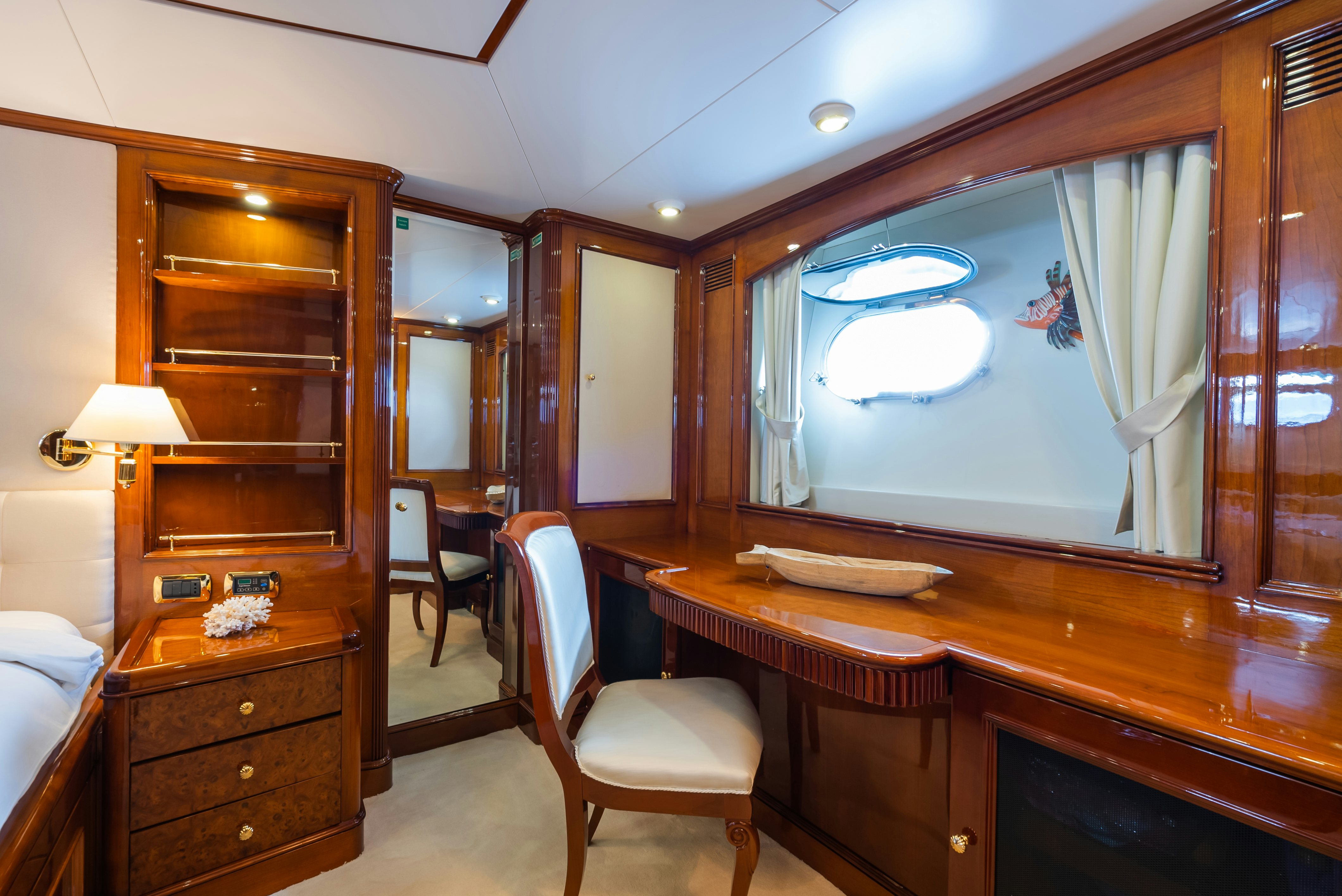 a room with a desk and a window aboard STELLA FIERA Yacht for Sale