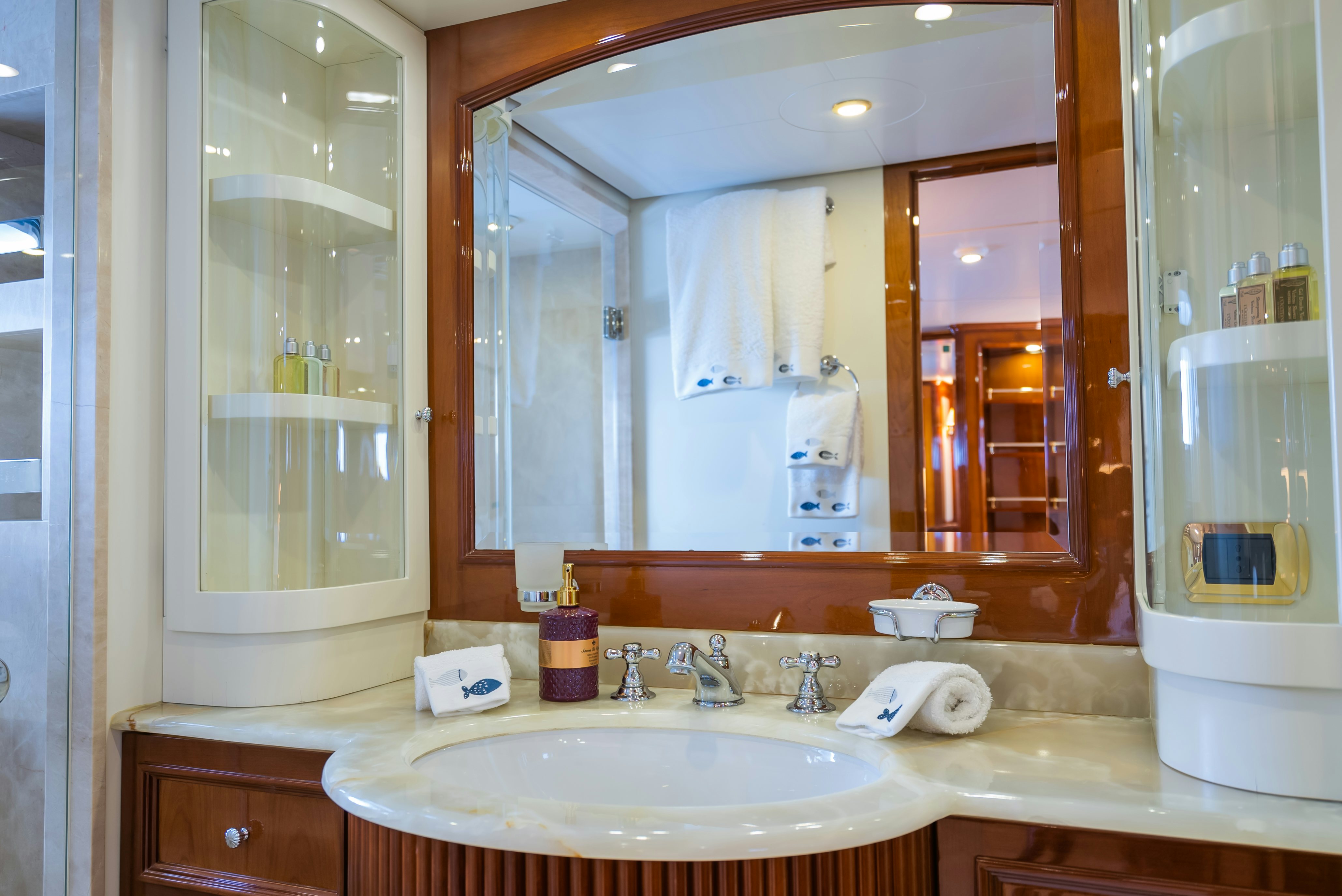 a bathroom with a large mirror aboard STELLA FIERA Yacht for Sale