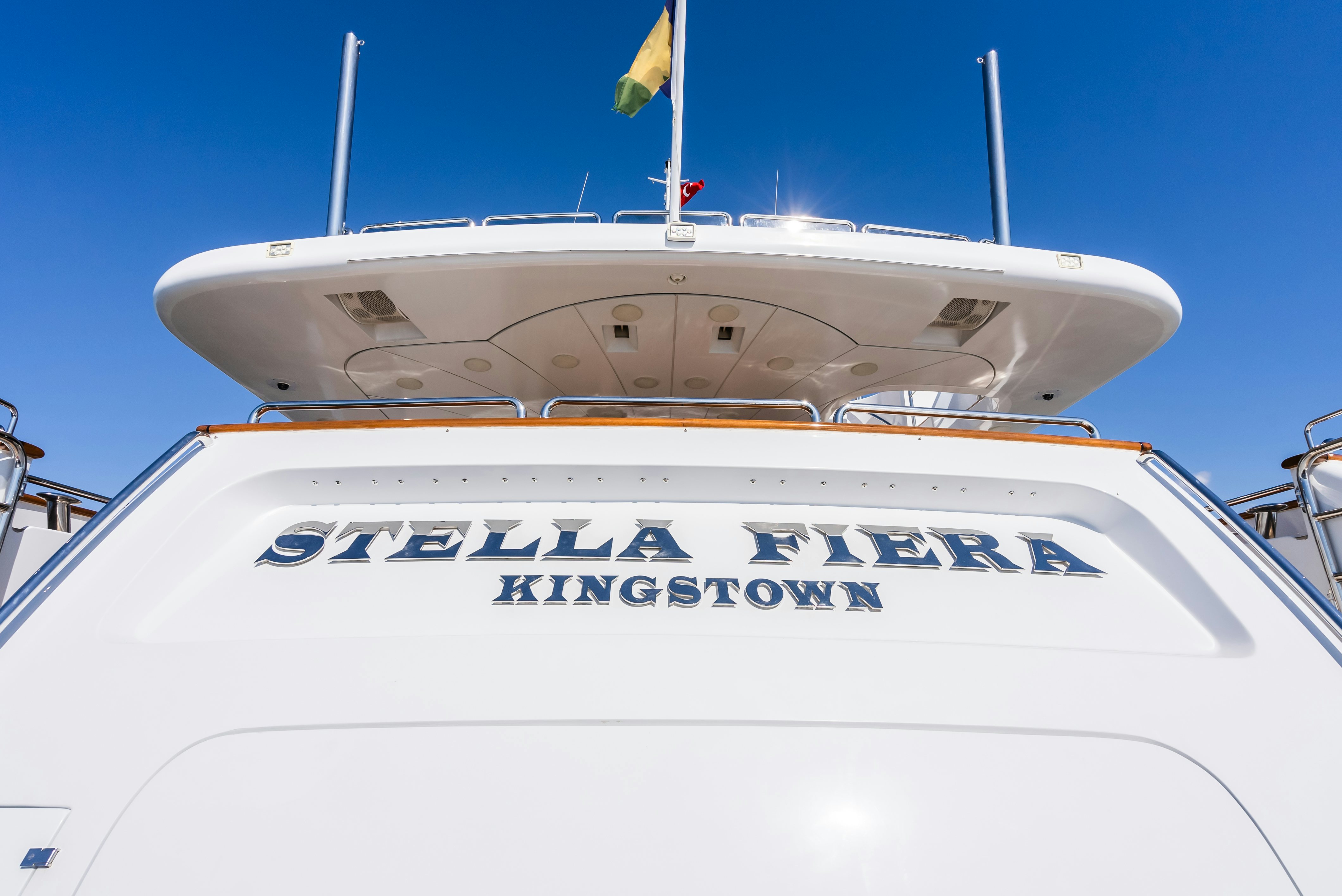 a white boat with blue lettering aboard STELLA FIERA Yacht for Sale
