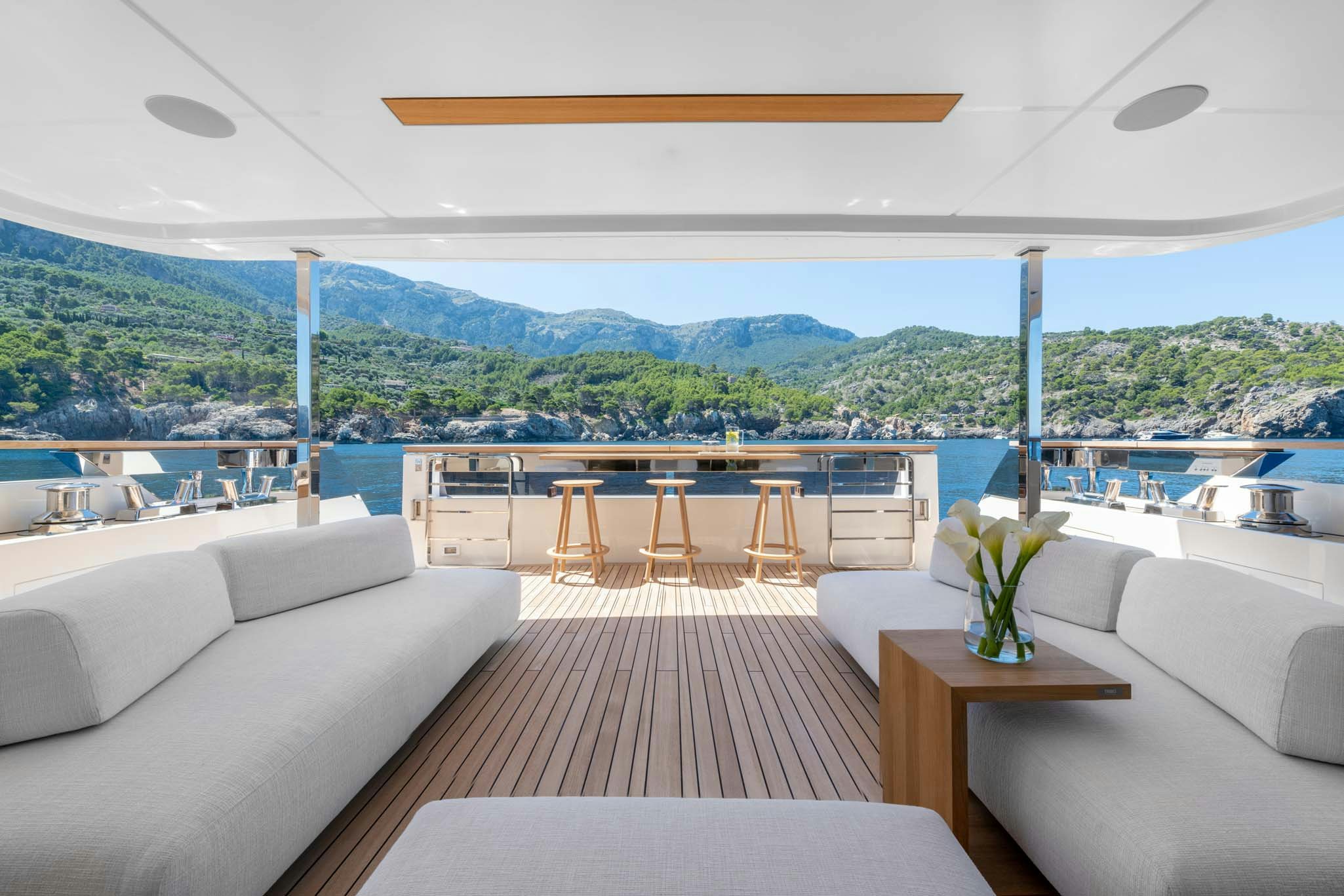 a living room with a large balcony aboard PALOMA Yacht for Charter