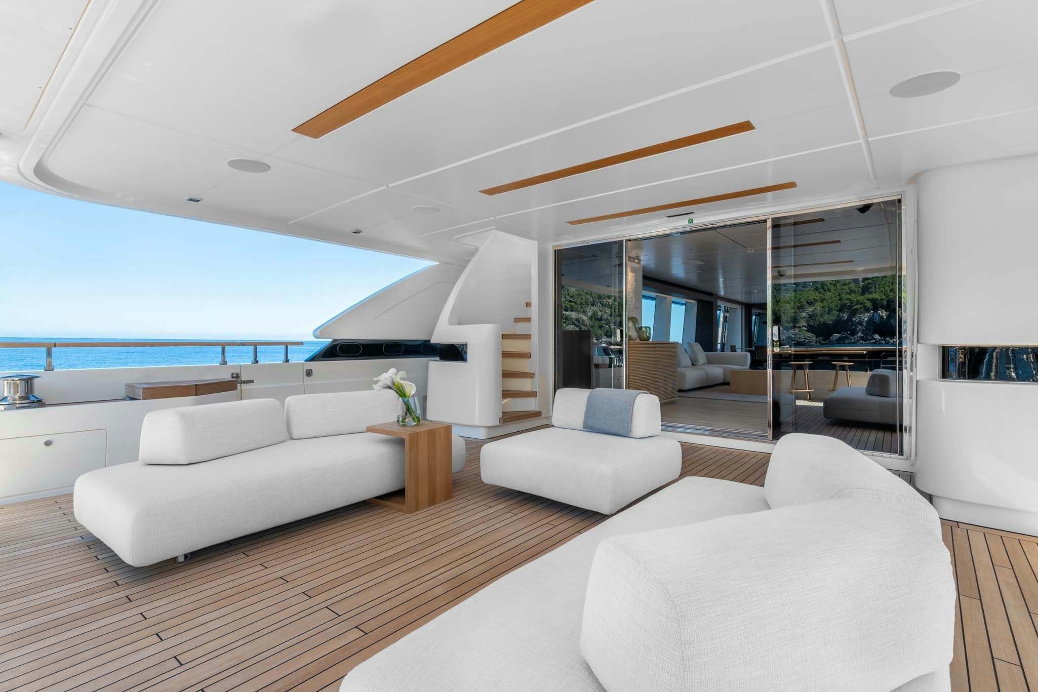 a living room with a large window aboard PALOMA Yacht for Charter