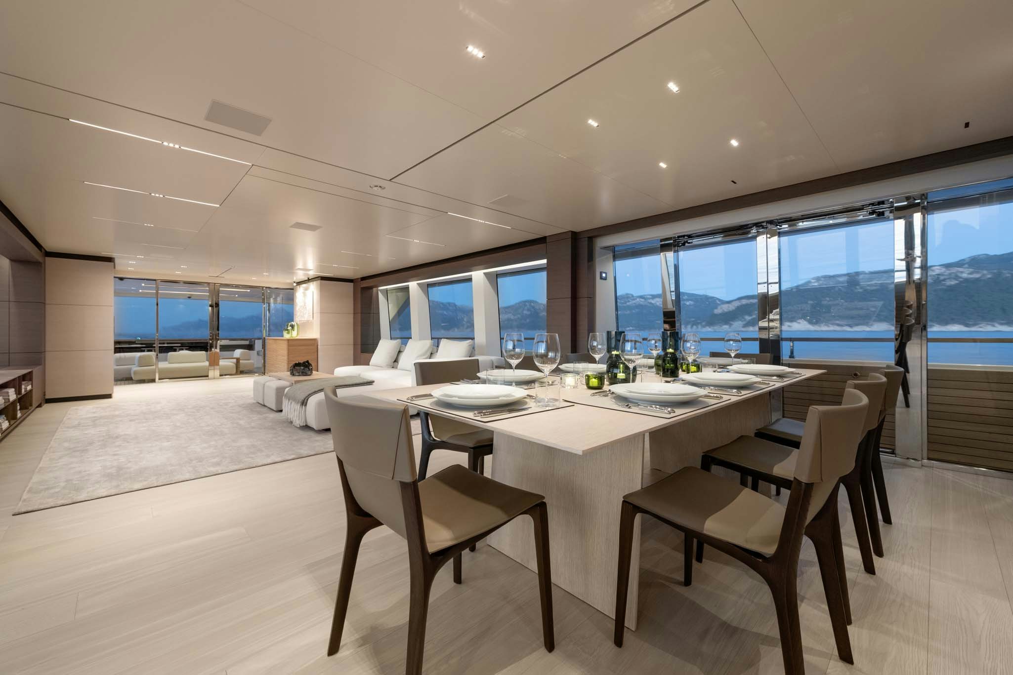 a large room with a table and chairs aboard PALOMA Yacht for Charter
