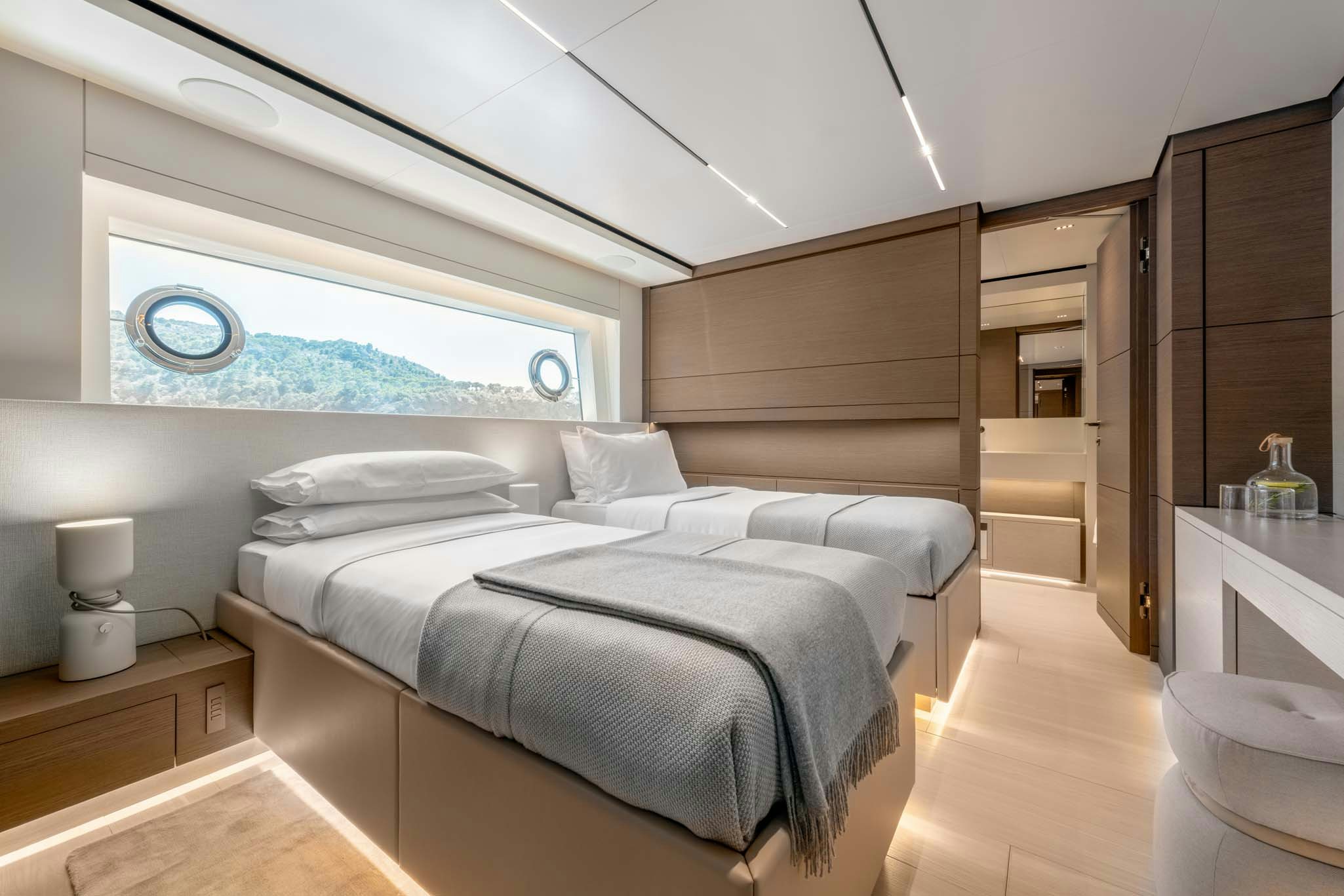 a room with a bed and a window aboard PALOMA Yacht for Charter