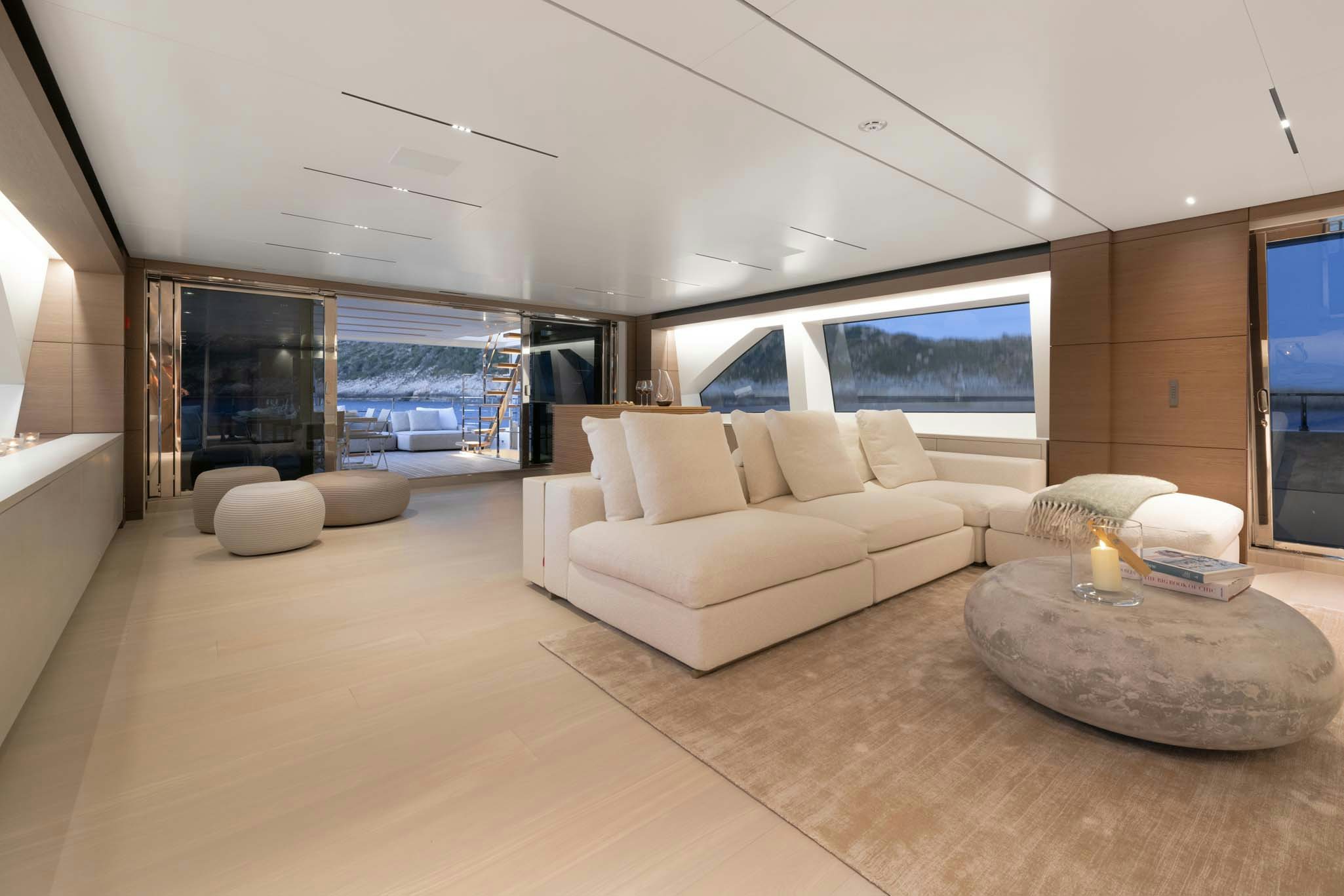 a living room with a large window aboard PALOMA Yacht for Charter