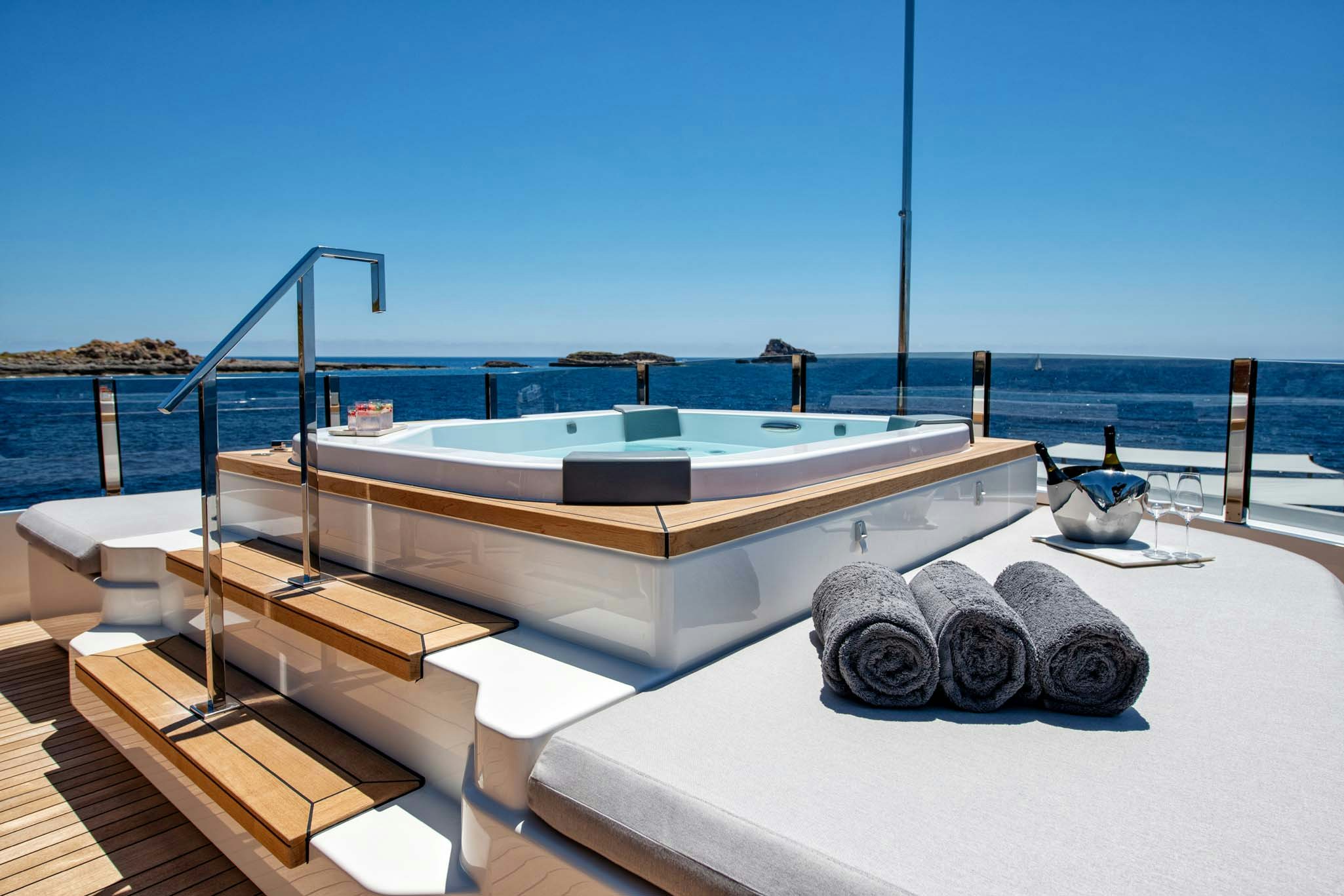a pool with a deck overlooking the ocean aboard PALOMA Yacht for Charter