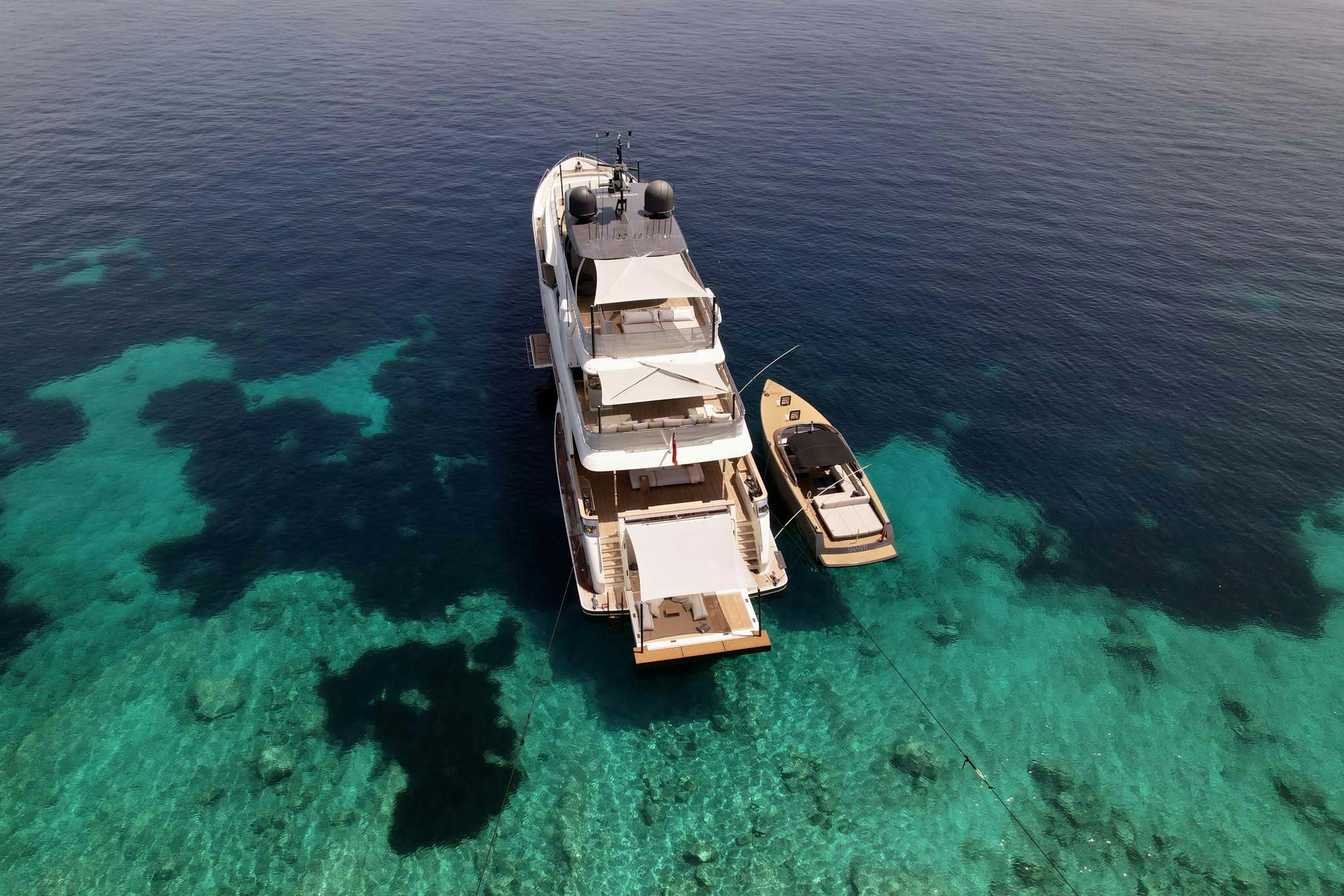 a large ship in the water aboard PALOMA Yacht for Charter