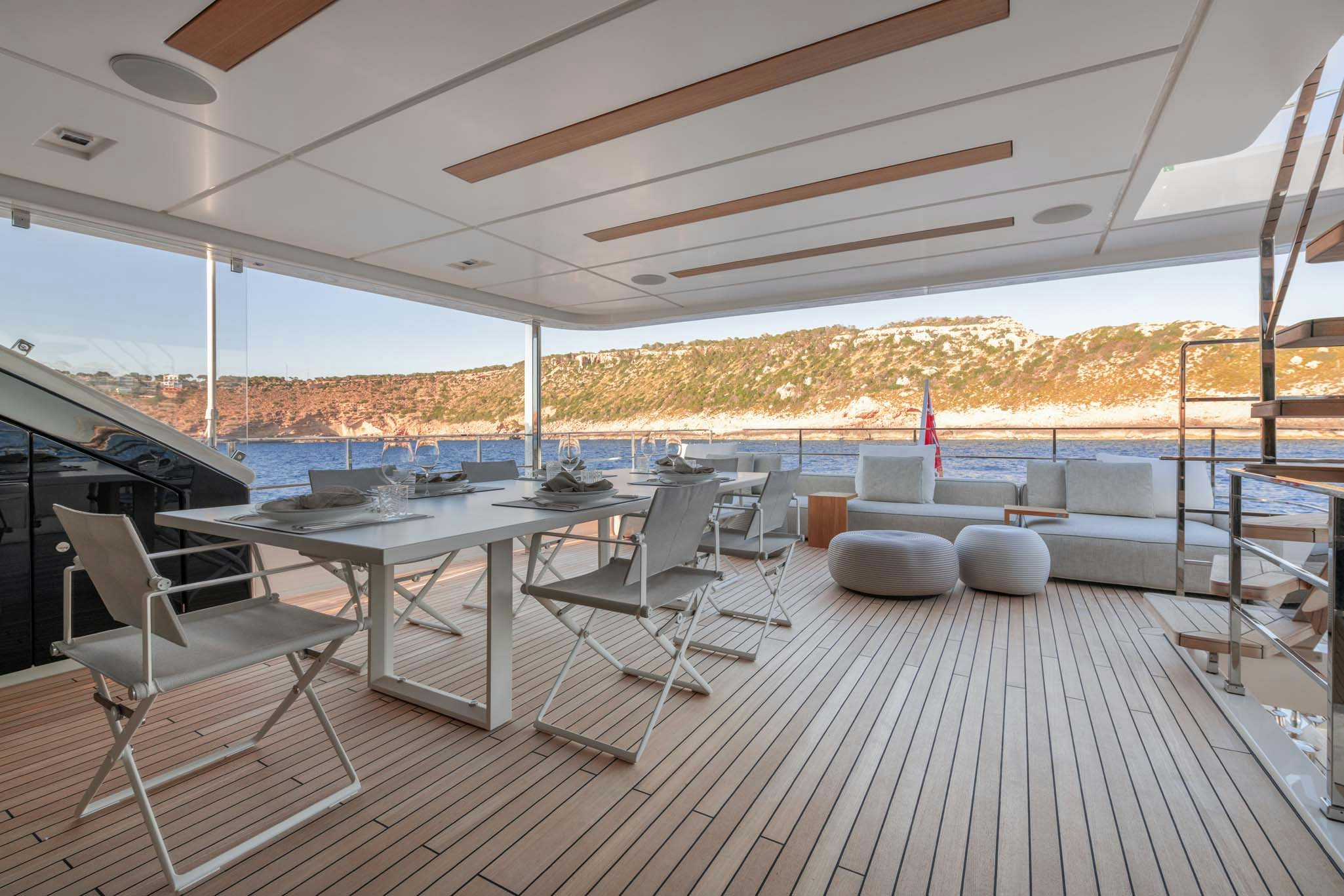 a deck with a view of the water and the city aboard PALOMA Yacht for Charter