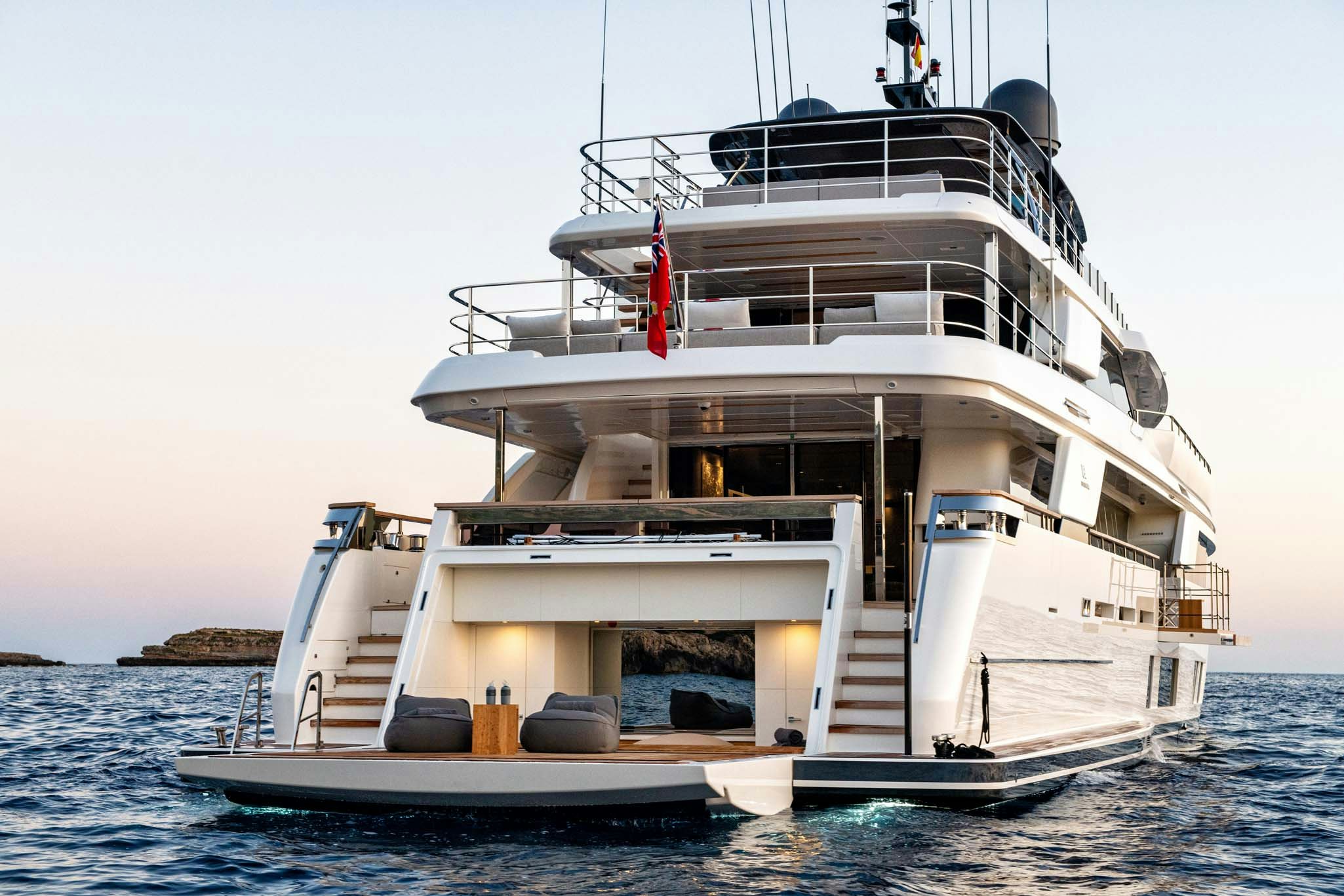 a large white boat in the water aboard PALOMA Yacht for Charter