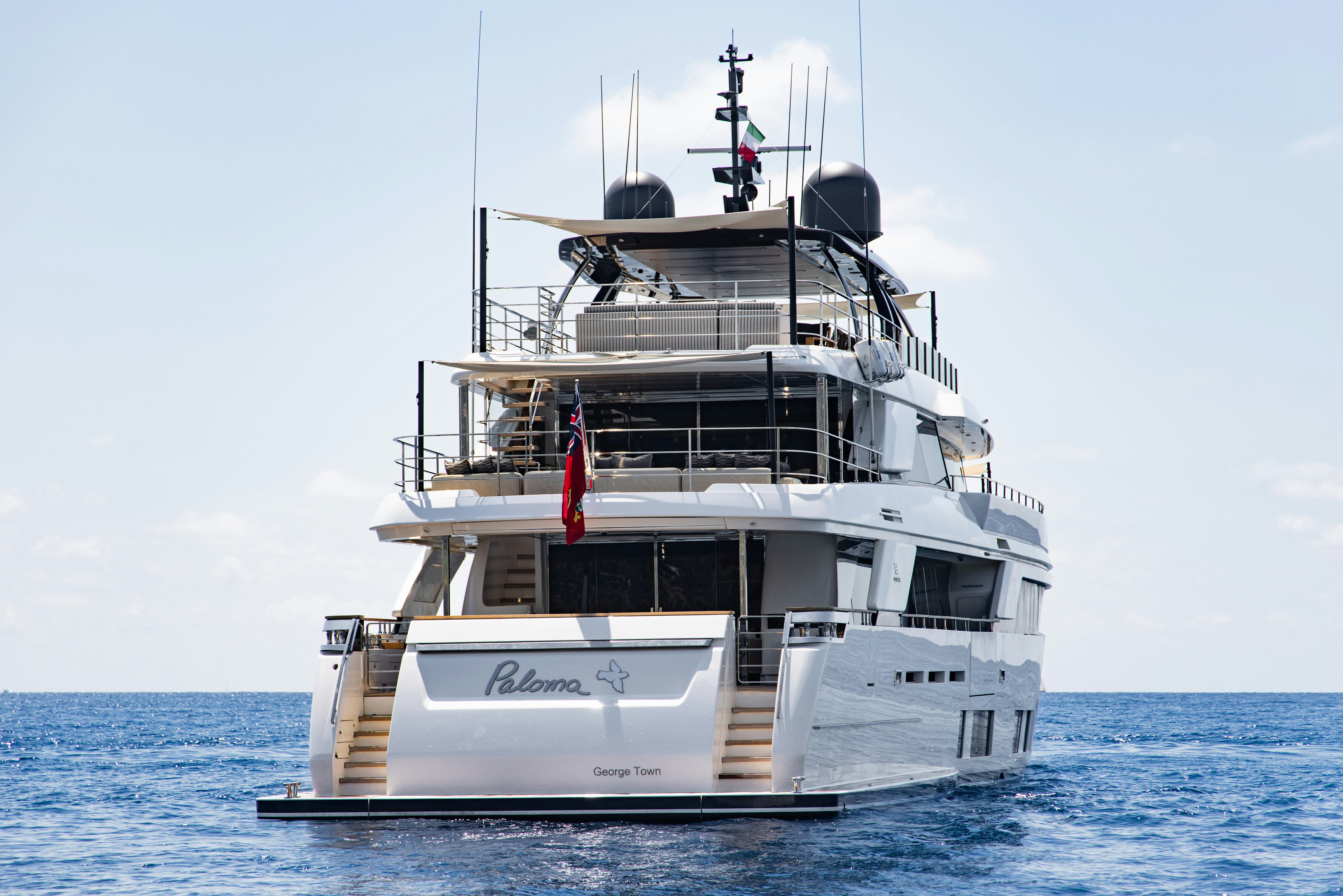a boat in the water with Thomas Point Shoal Light in the background aboard PALOMA Yacht for Charter