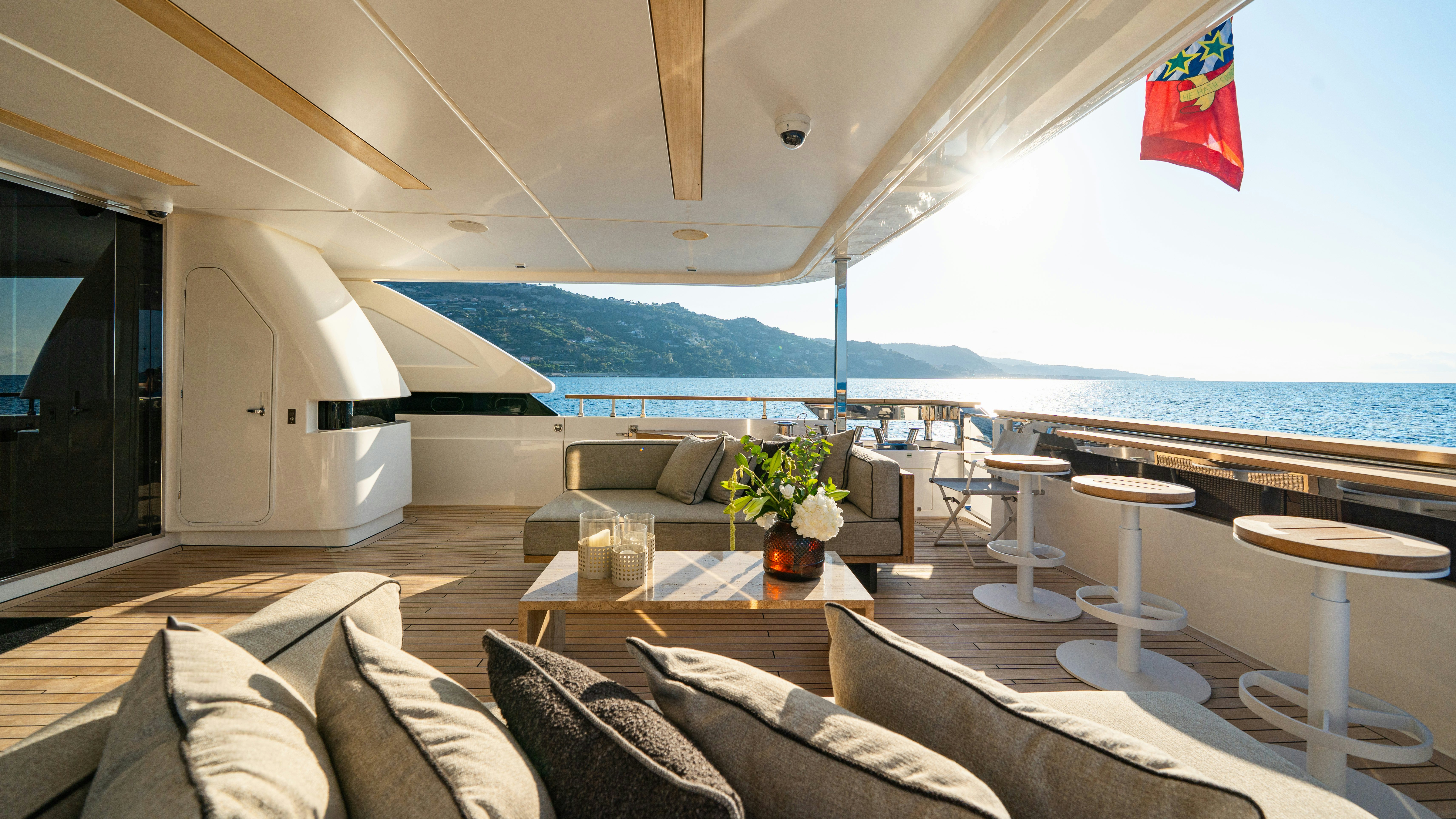 a living room with a large balcony aboard PALOMA Yacht for Charter