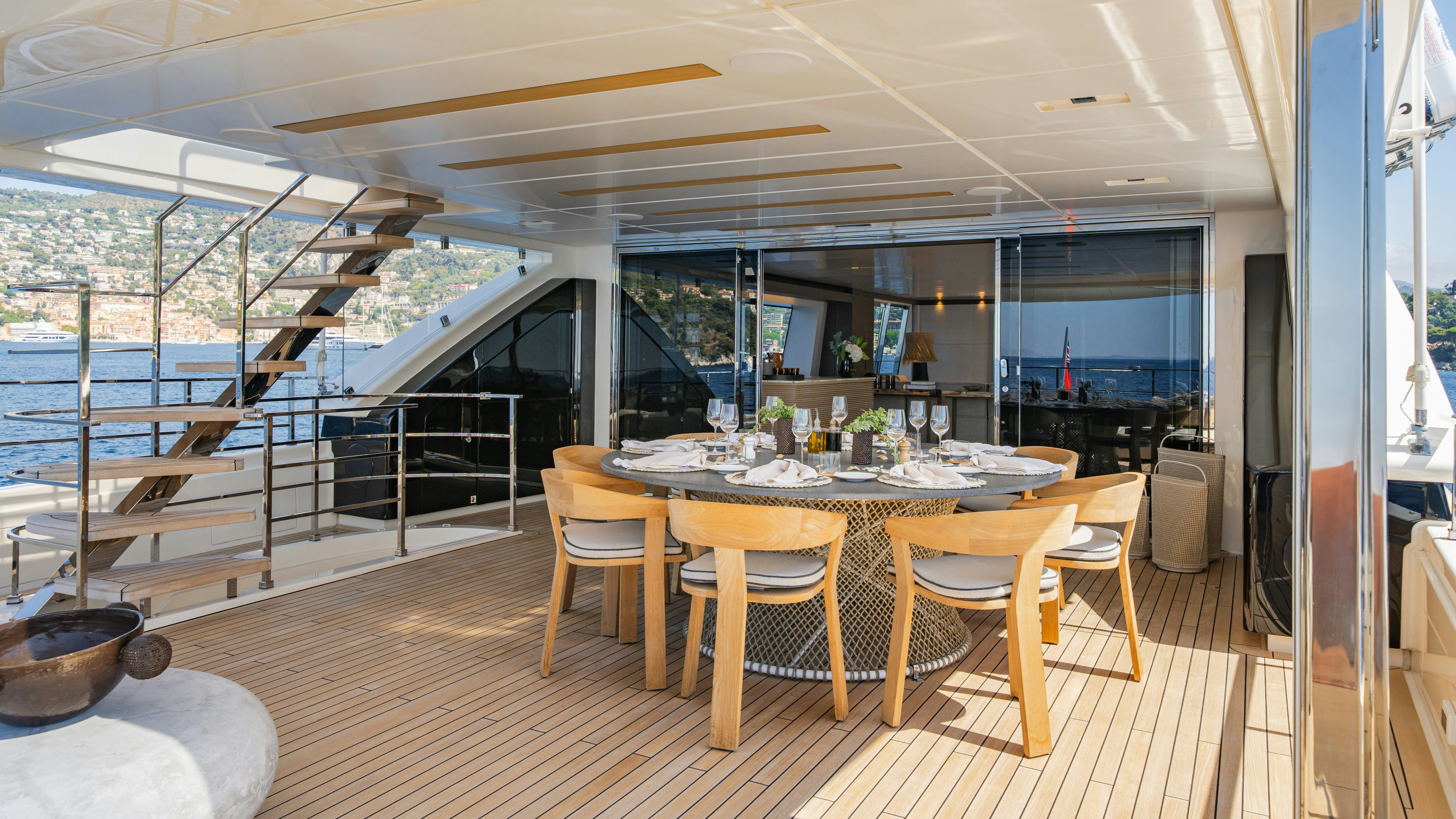 a large room with a table and chairs aboard PALOMA Yacht for Charter