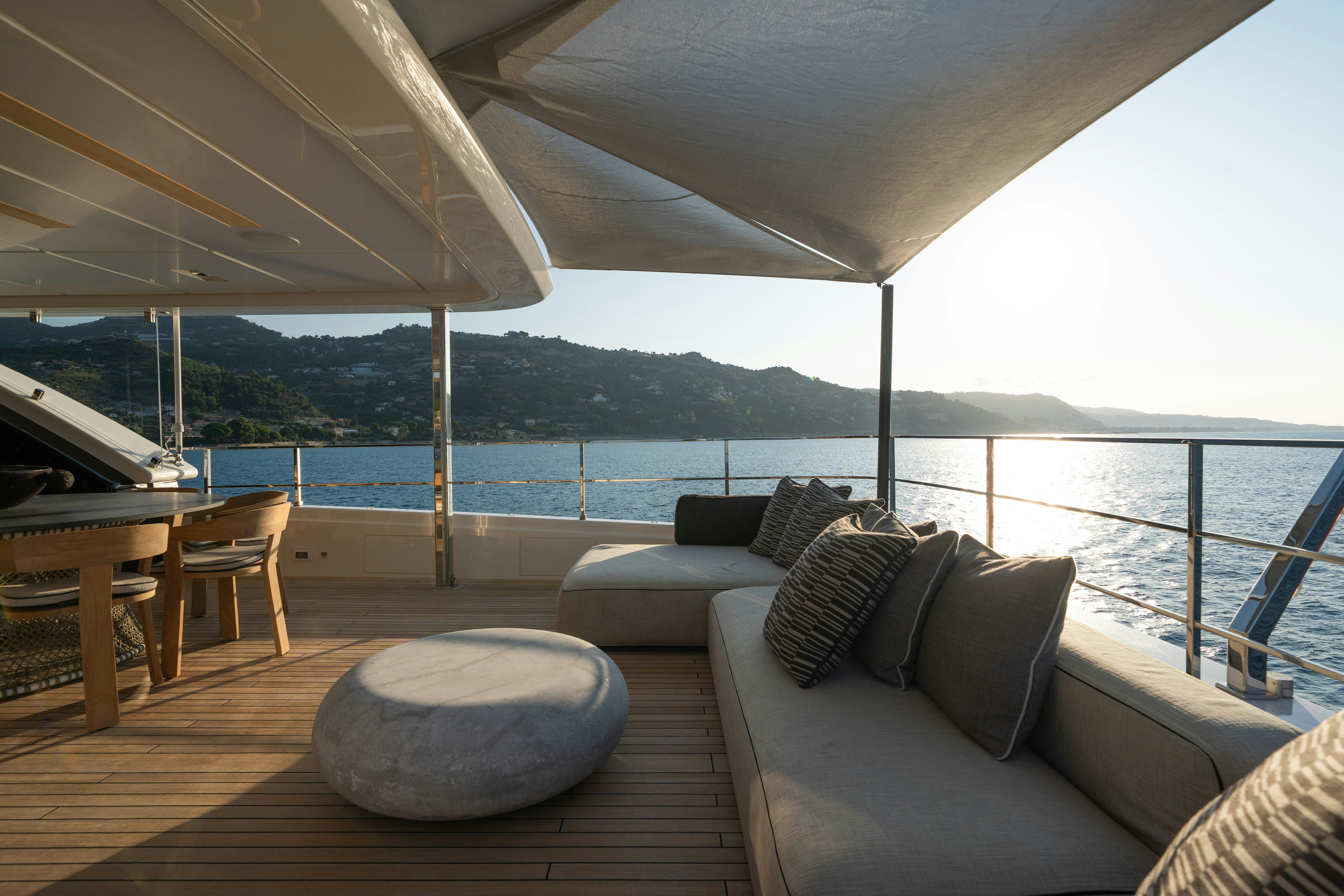 a living room with a large body of water aboard PALOMA Yacht for Charter