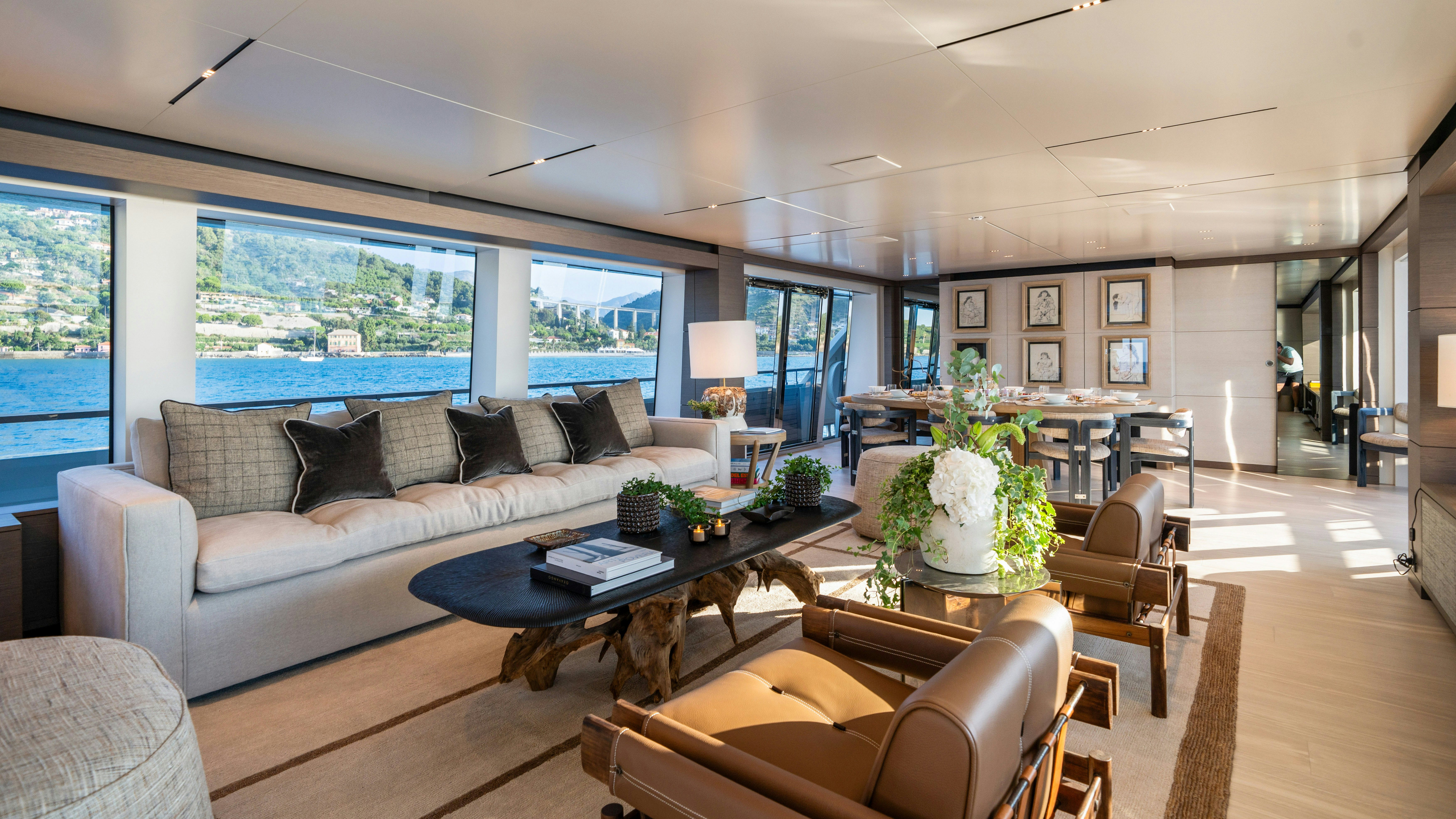 a living room with a large window aboard PALOMA Yacht for Charter