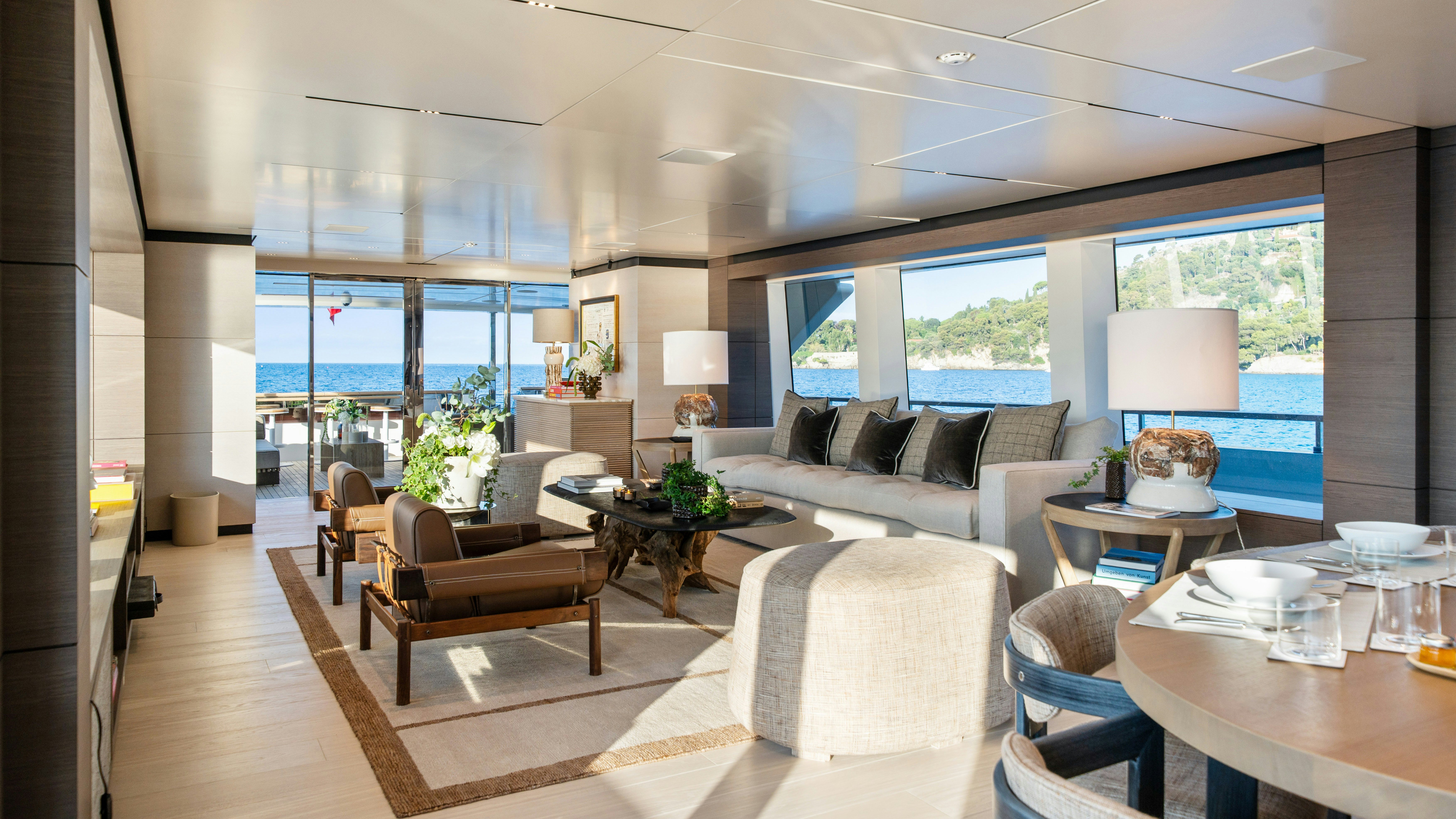 a living room with a large window aboard PALOMA Yacht for Charter