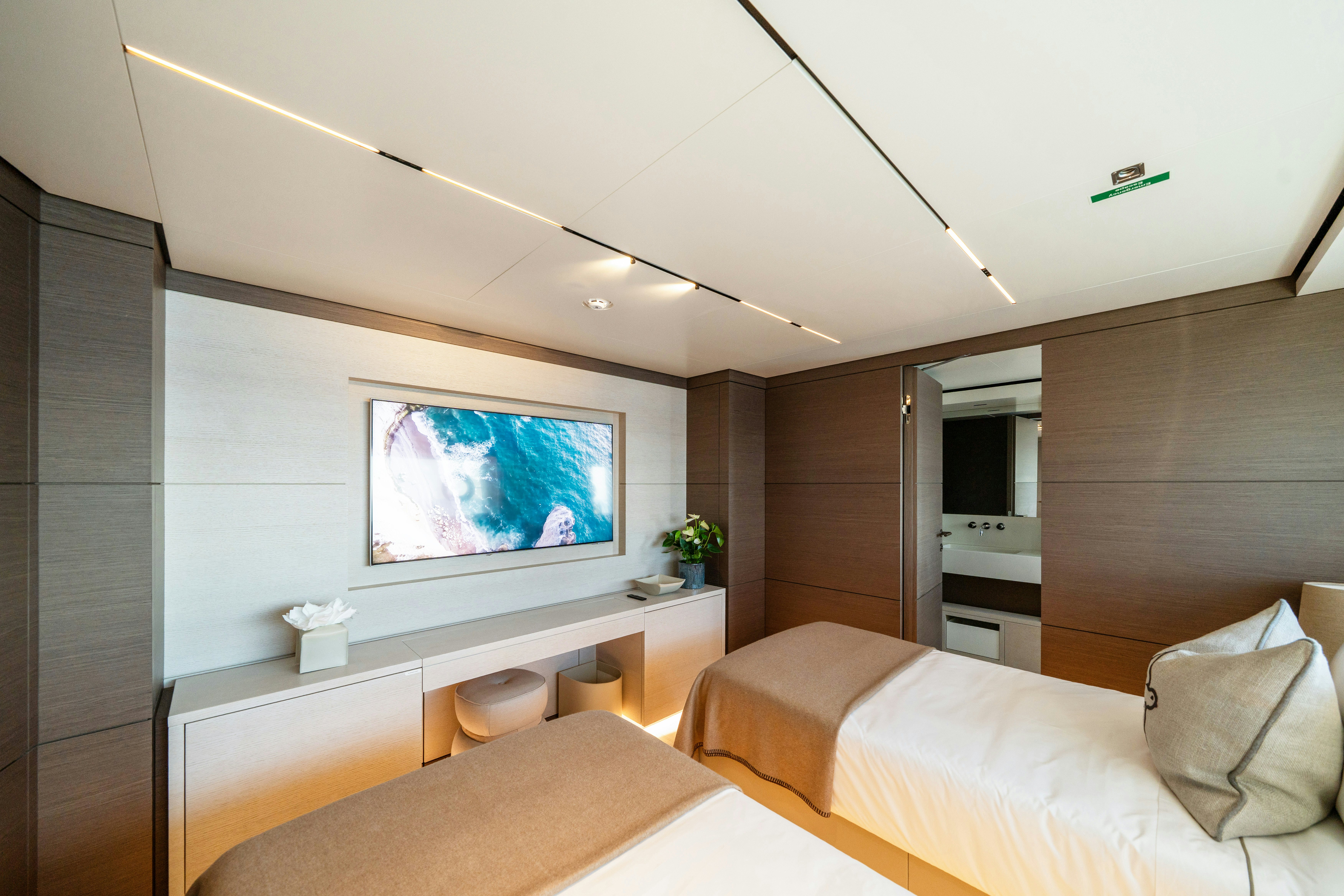 a bedroom with a tv and a bed aboard PALOMA Yacht for Charter