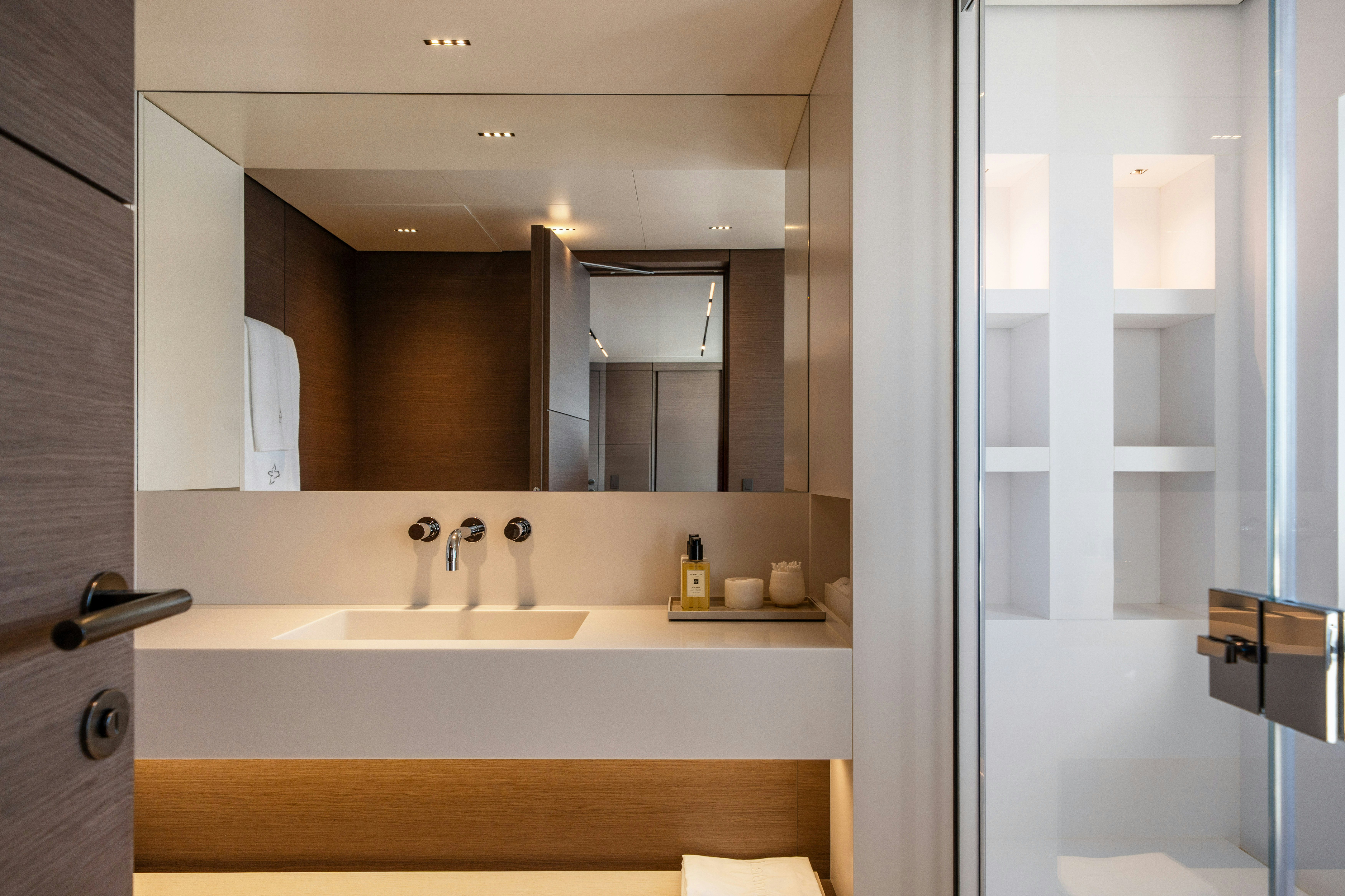 a bathroom with a sink and a mirror aboard PALOMA Yacht for Charter