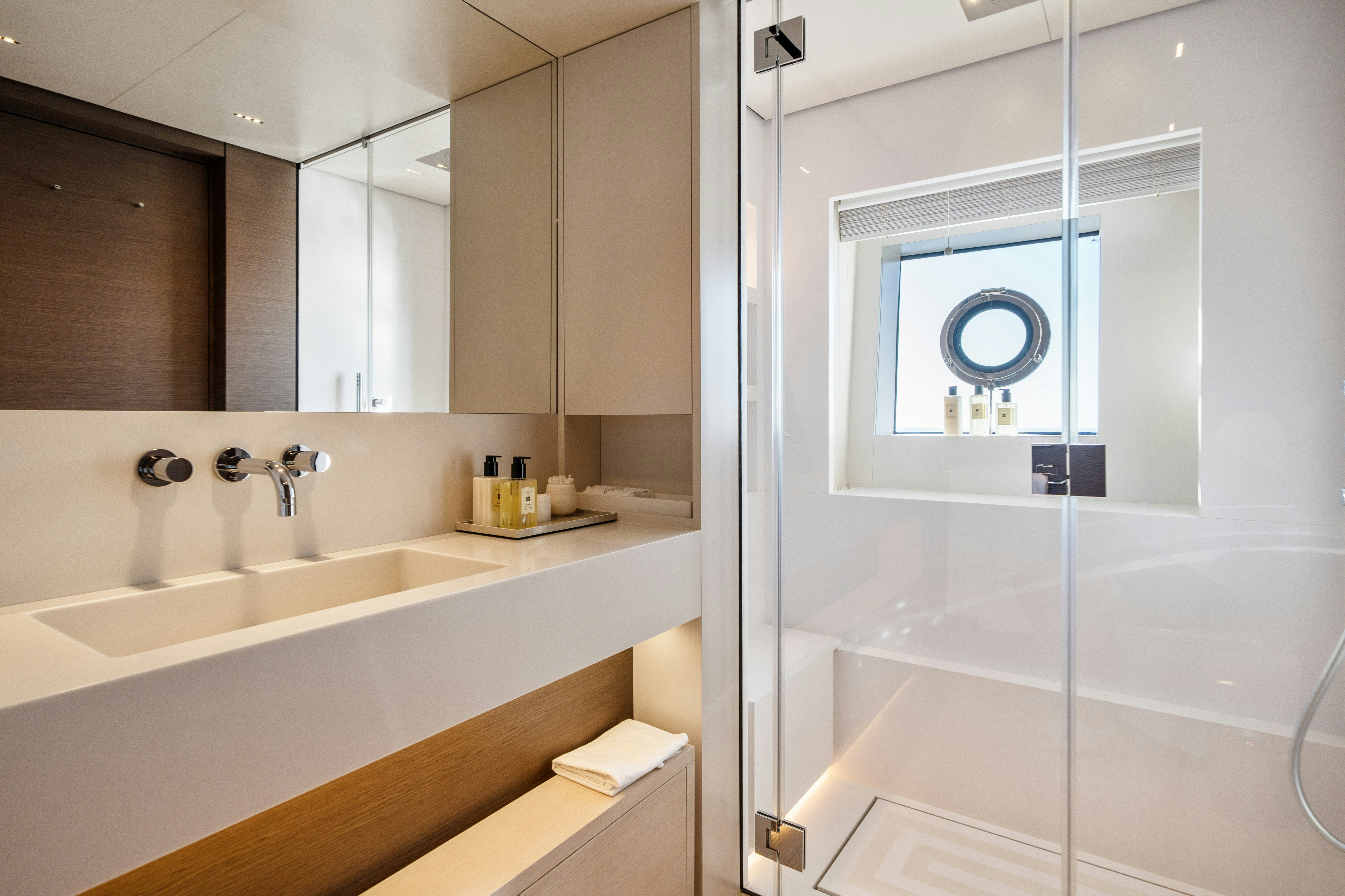 a bathroom with a glass shower aboard PALOMA Yacht for Charter
