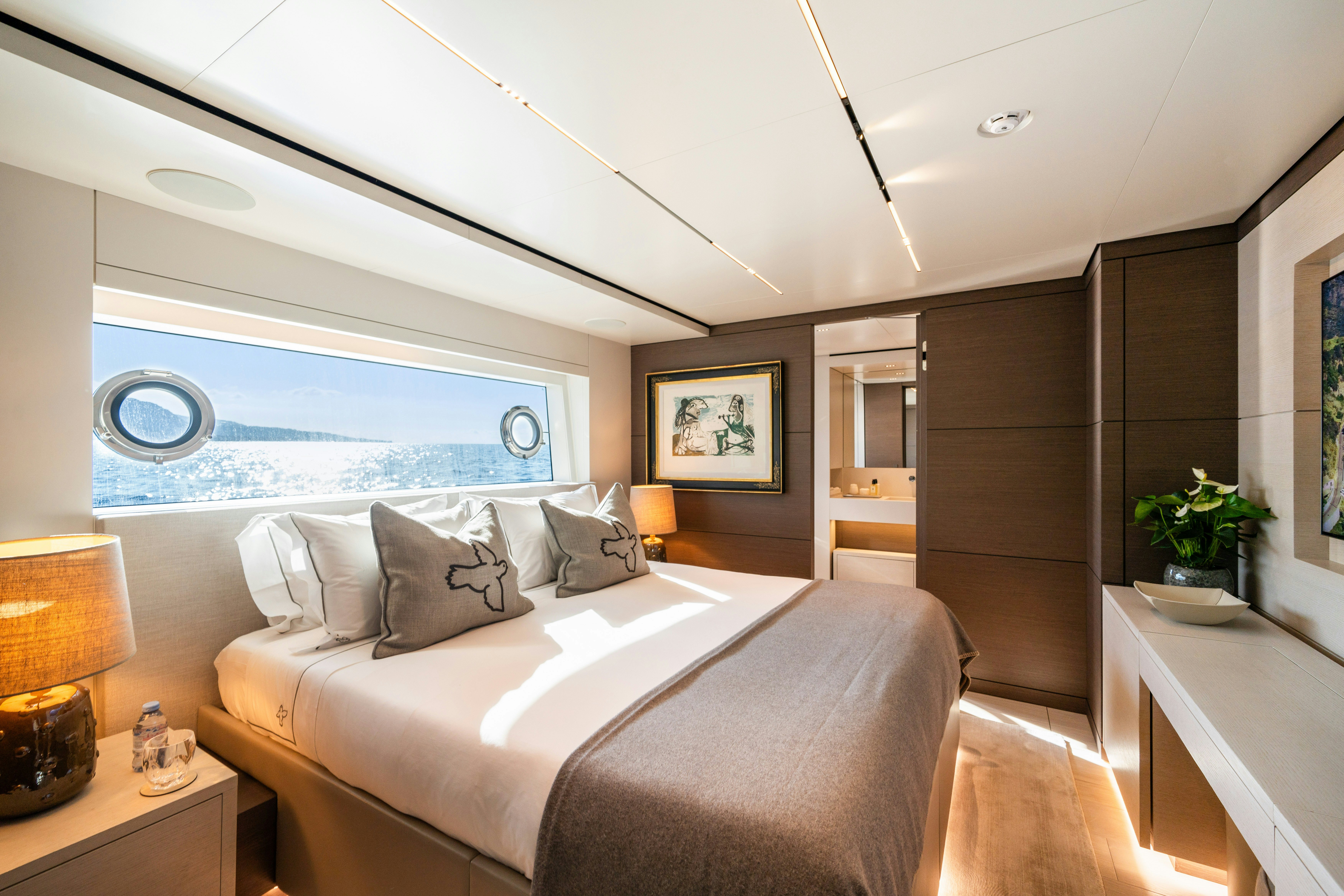 a bedroom with a large bed aboard PALOMA Yacht for Charter