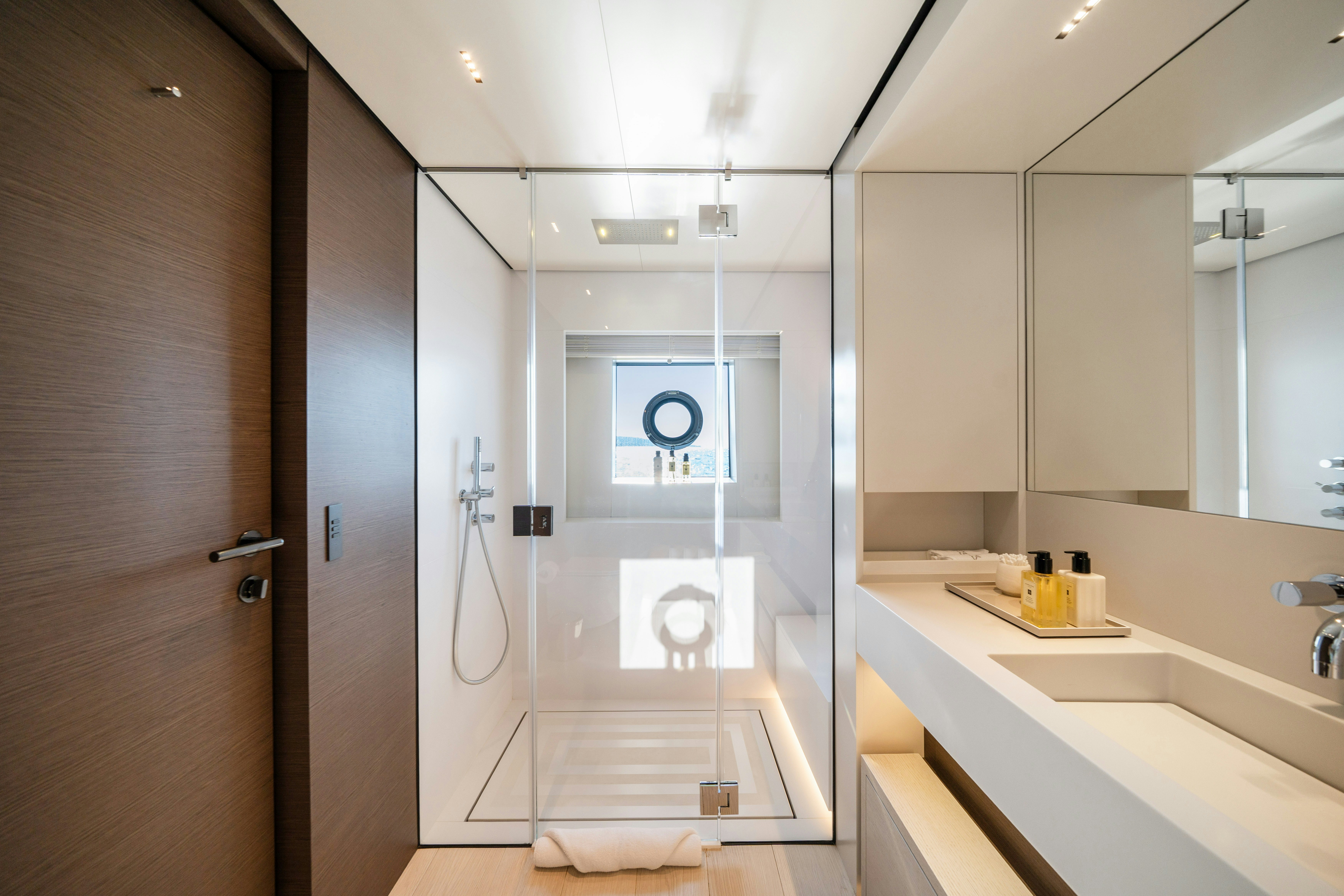 a bathroom with a shower unit and sink aboard PALOMA Yacht for Charter