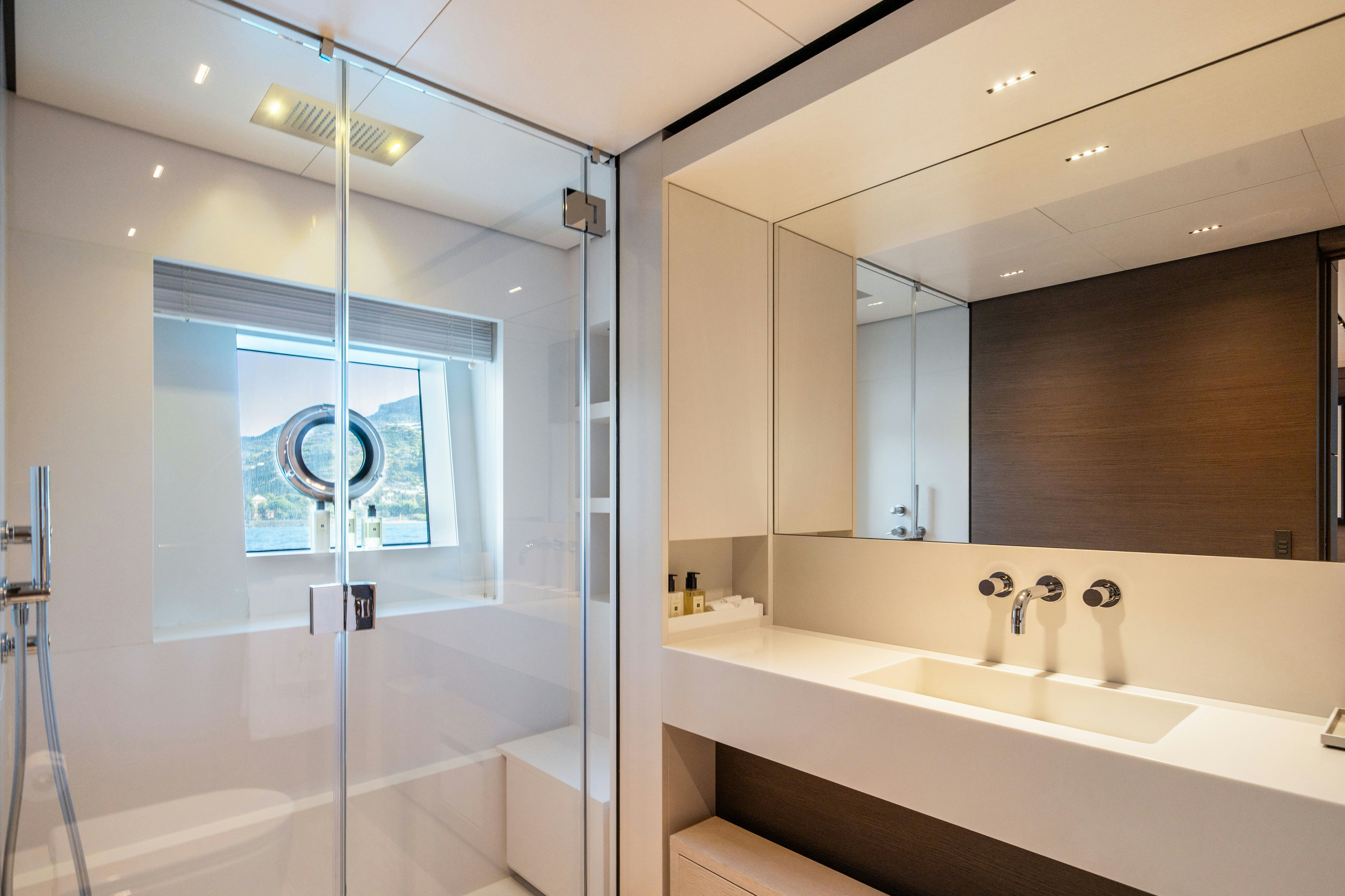 a bathroom with a glass shower aboard PALOMA Yacht for Charter