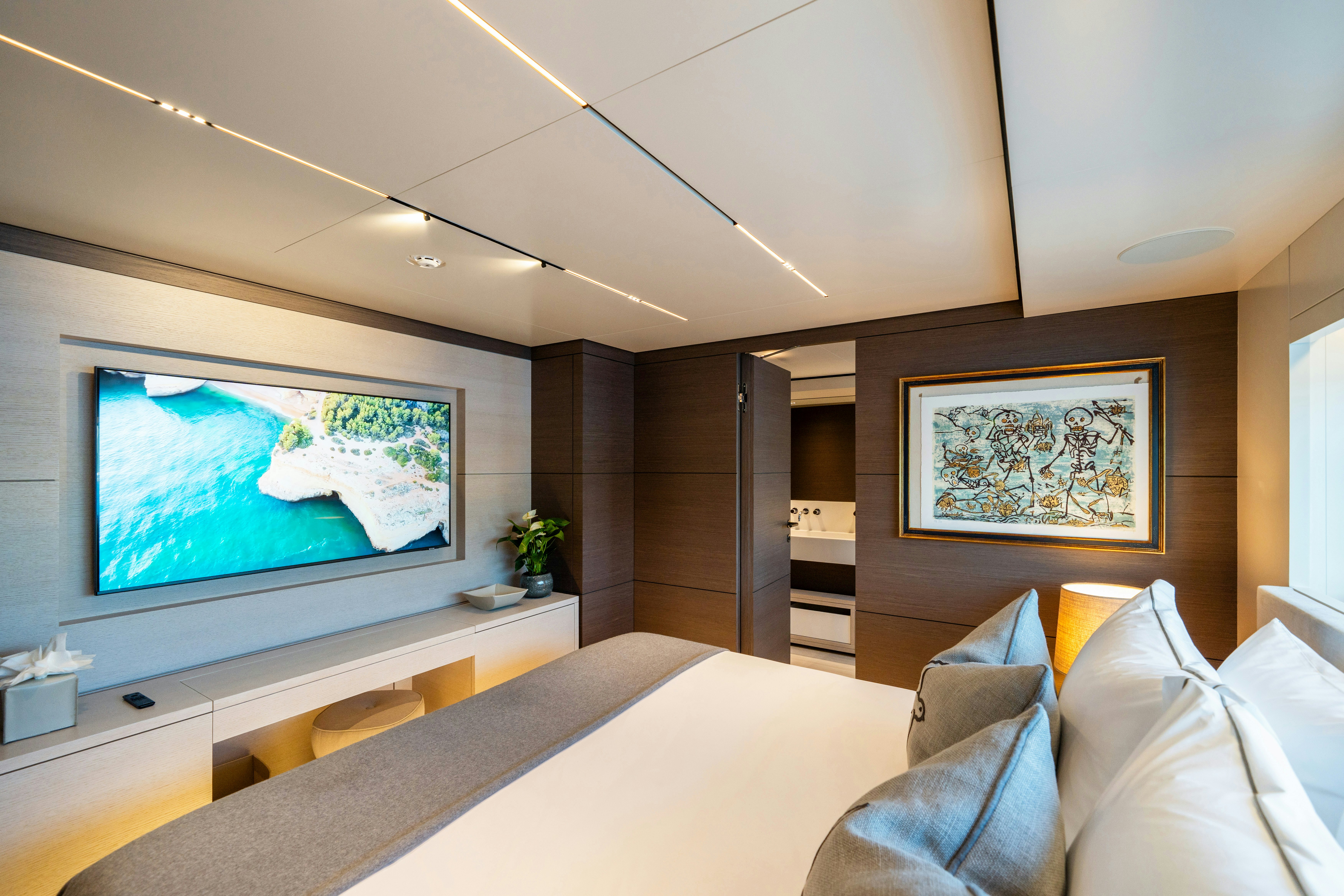 a room with a bed and a tv aboard PALOMA Yacht for Charter