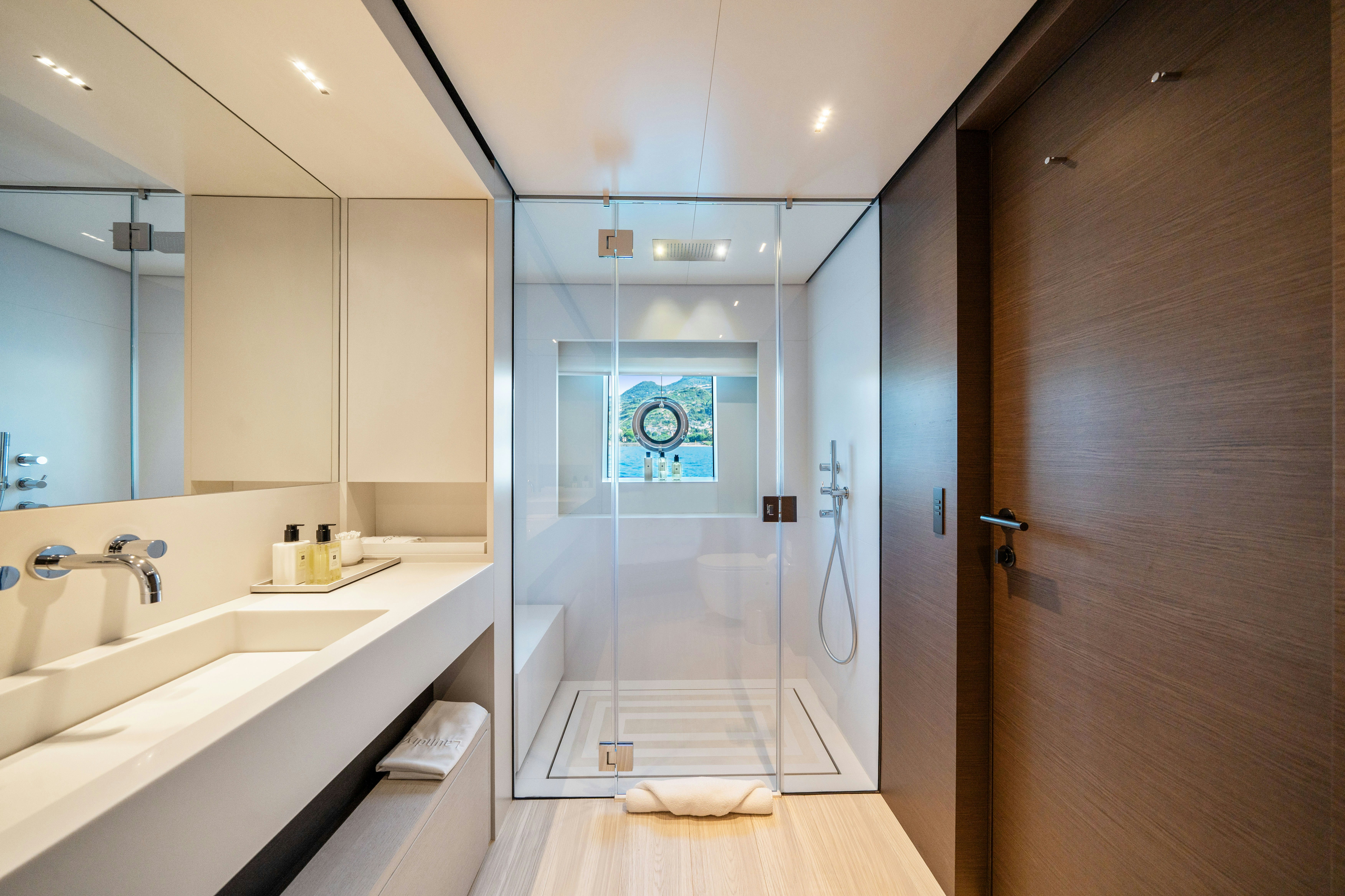 a bathroom with a glass shower aboard PALOMA Yacht for Charter