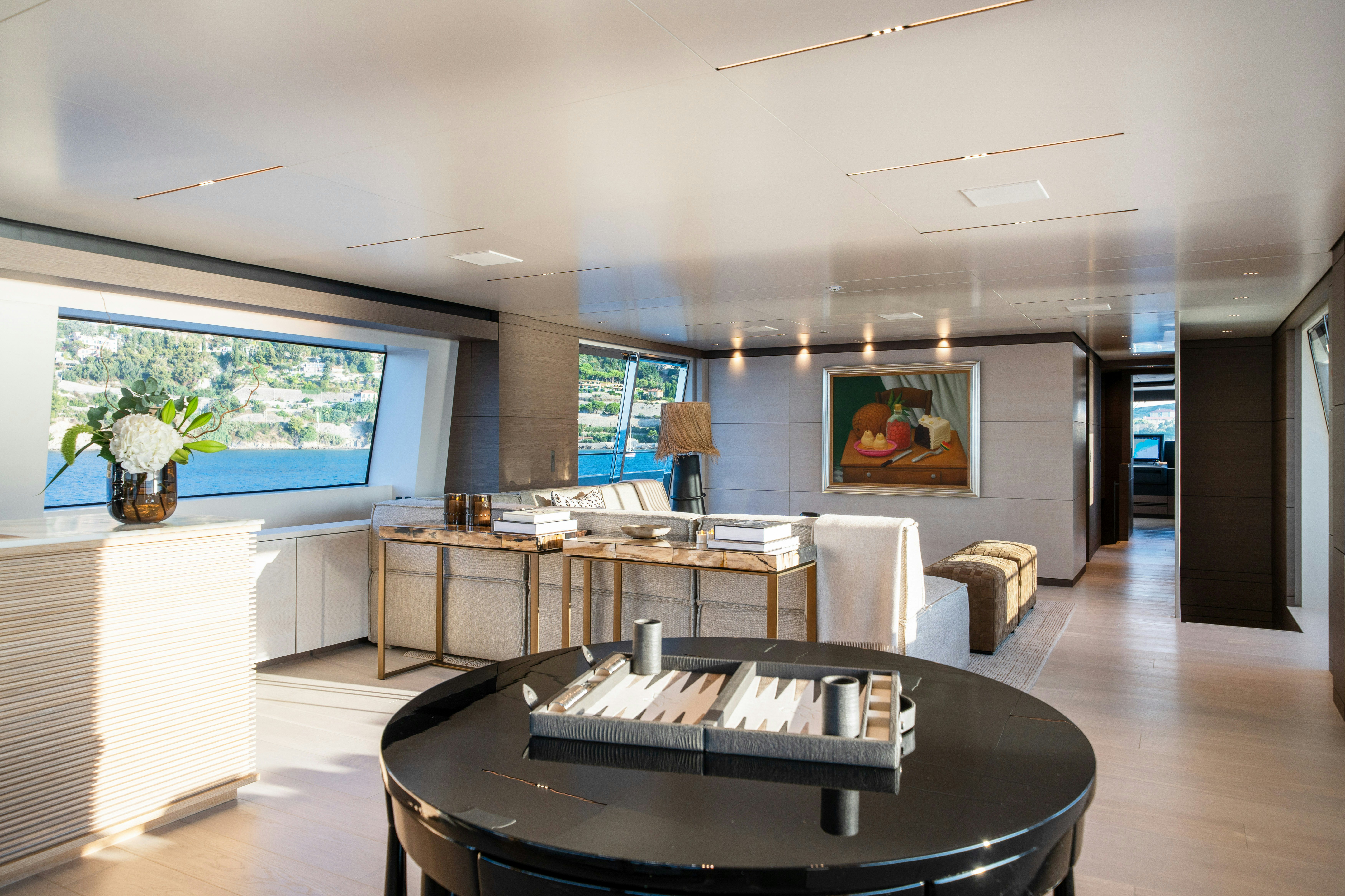 a large room with a table and chairs aboard PALOMA Yacht for Charter