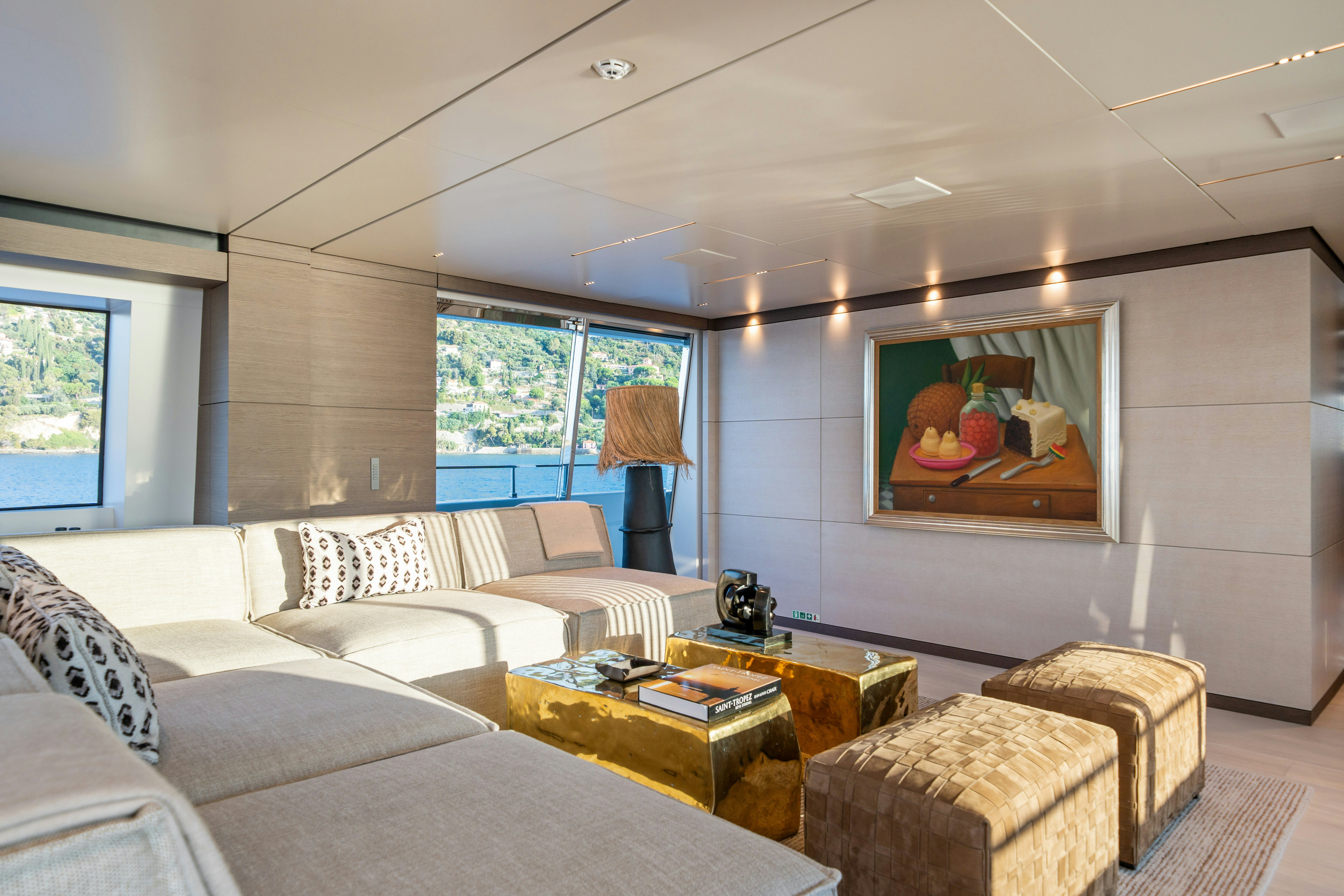a living room with a large screen aboard PALOMA Yacht for Charter