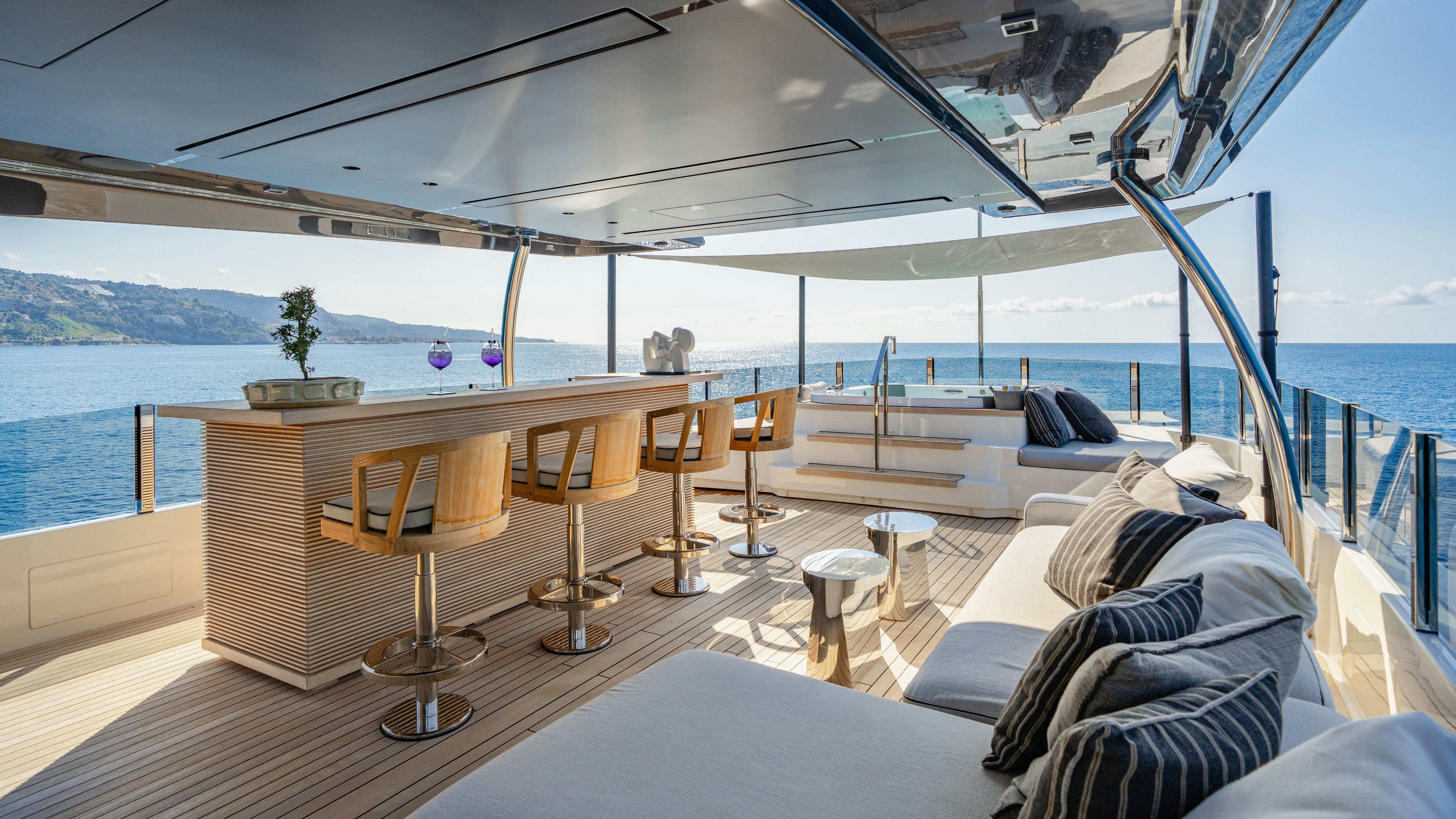 a boat with a large deck and chairs on it aboard PALOMA Yacht for Charter