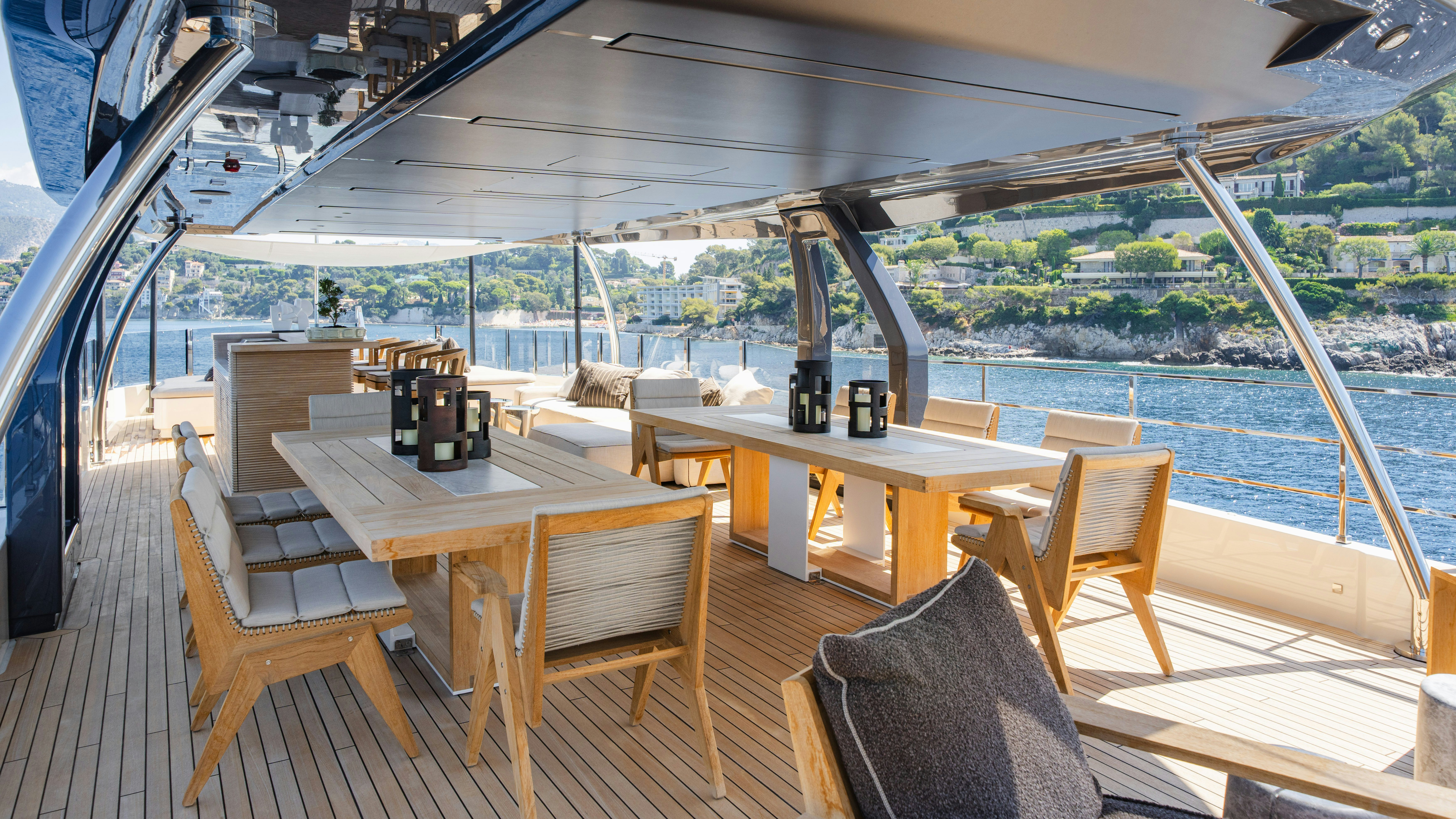 a table and chairs on a deck aboard PALOMA Yacht for Charter