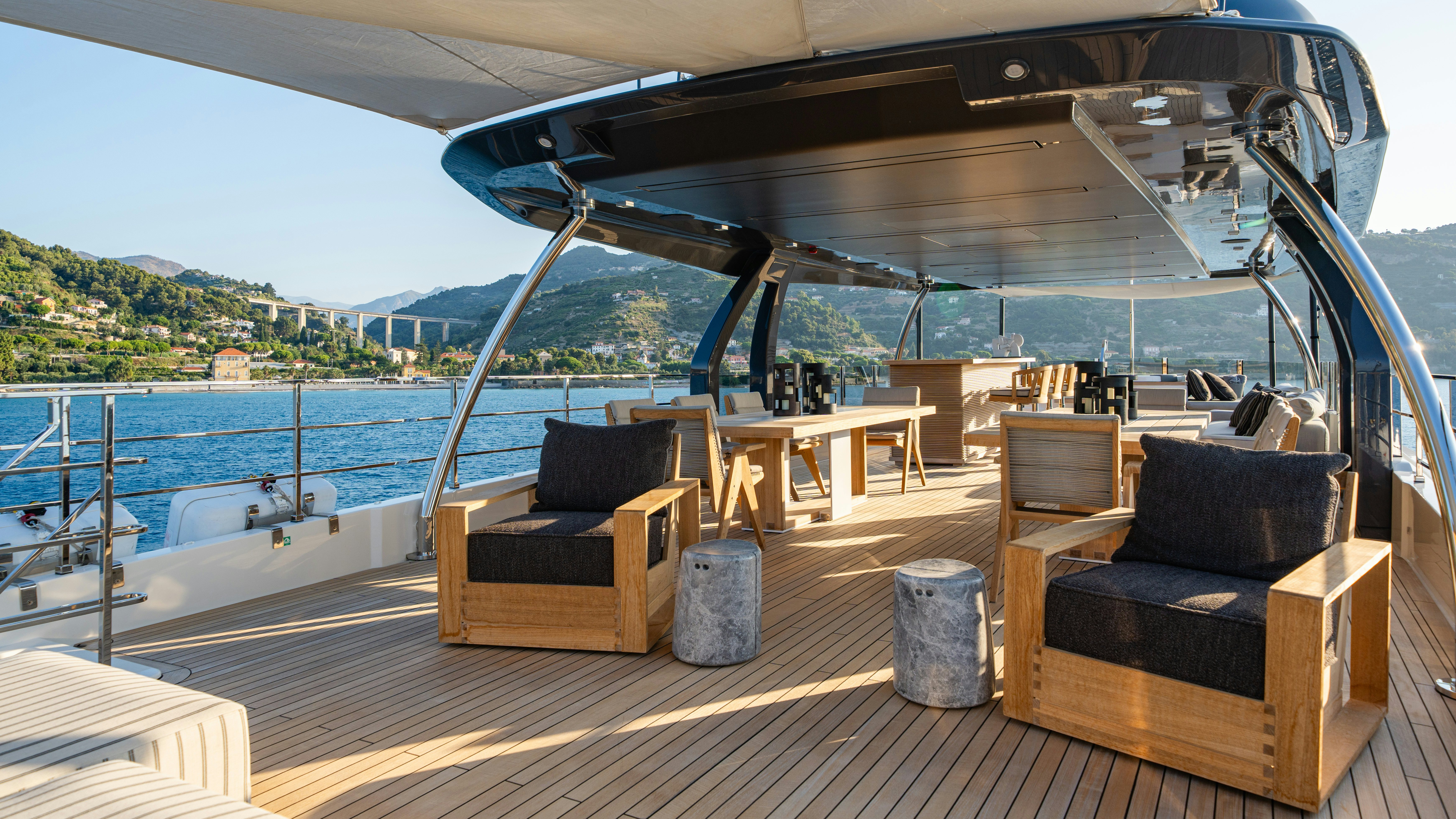a deck with a view of the ocean and a deck aboard PALOMA Yacht for Charter