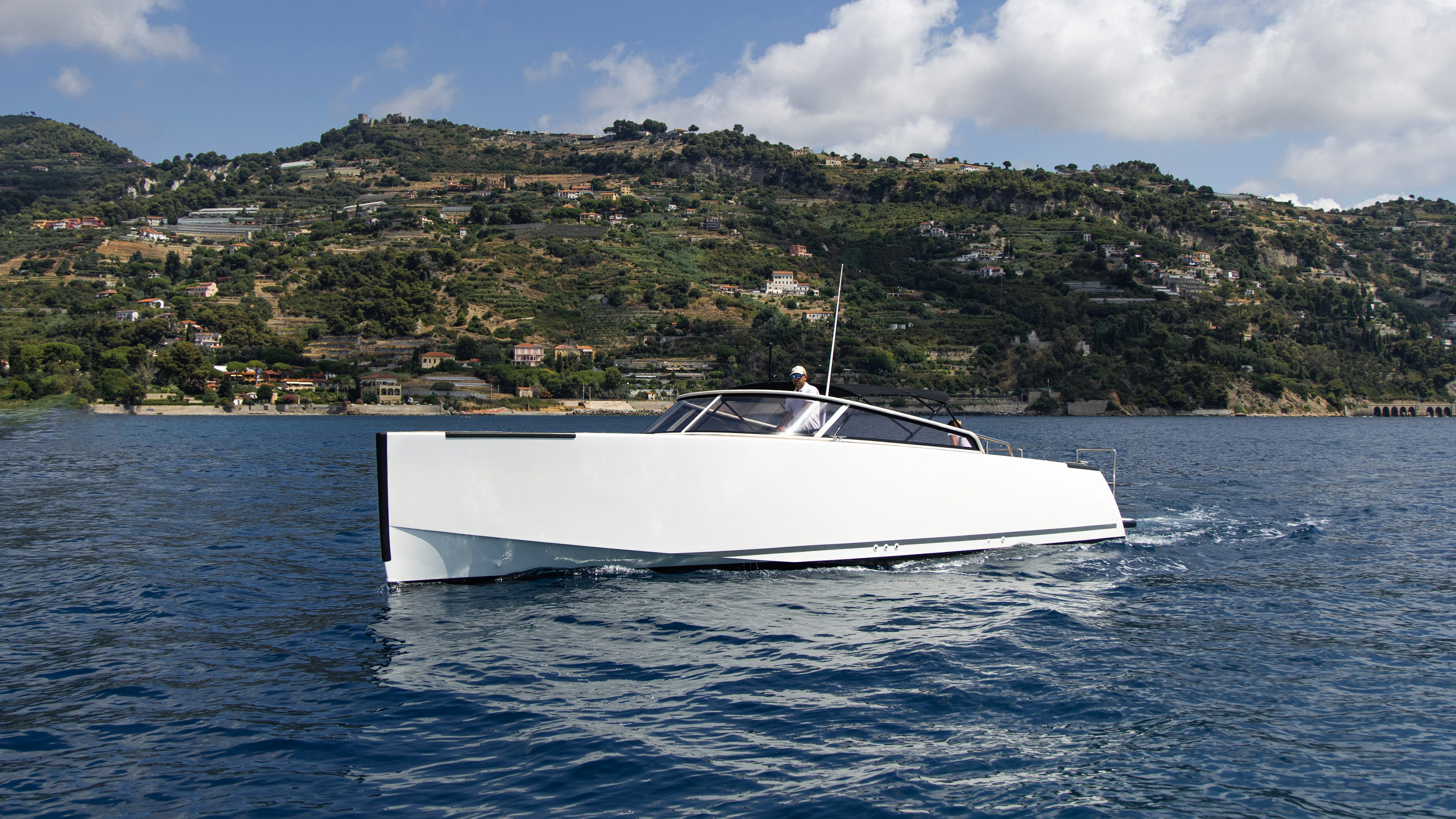 a white boat on the water aboard PALOMA Yacht for Charter