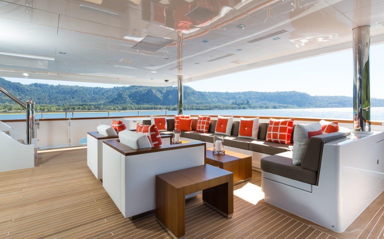 a room with a couch and a table aboard CHASSEUR Yacht for Charter